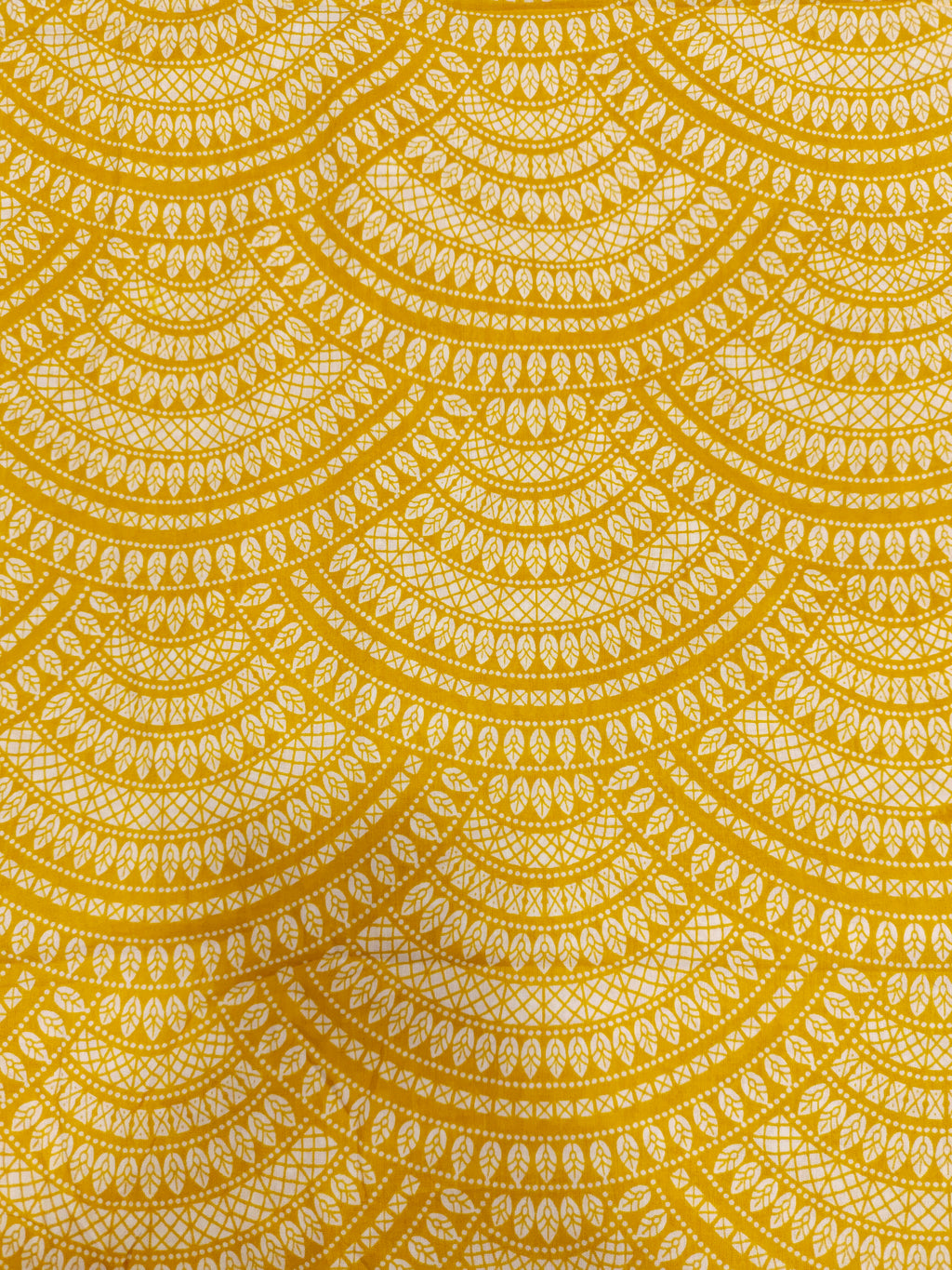 Yellow cotton half circular print.