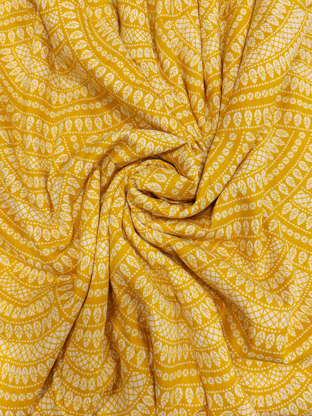 Yellow cotton half circular print.