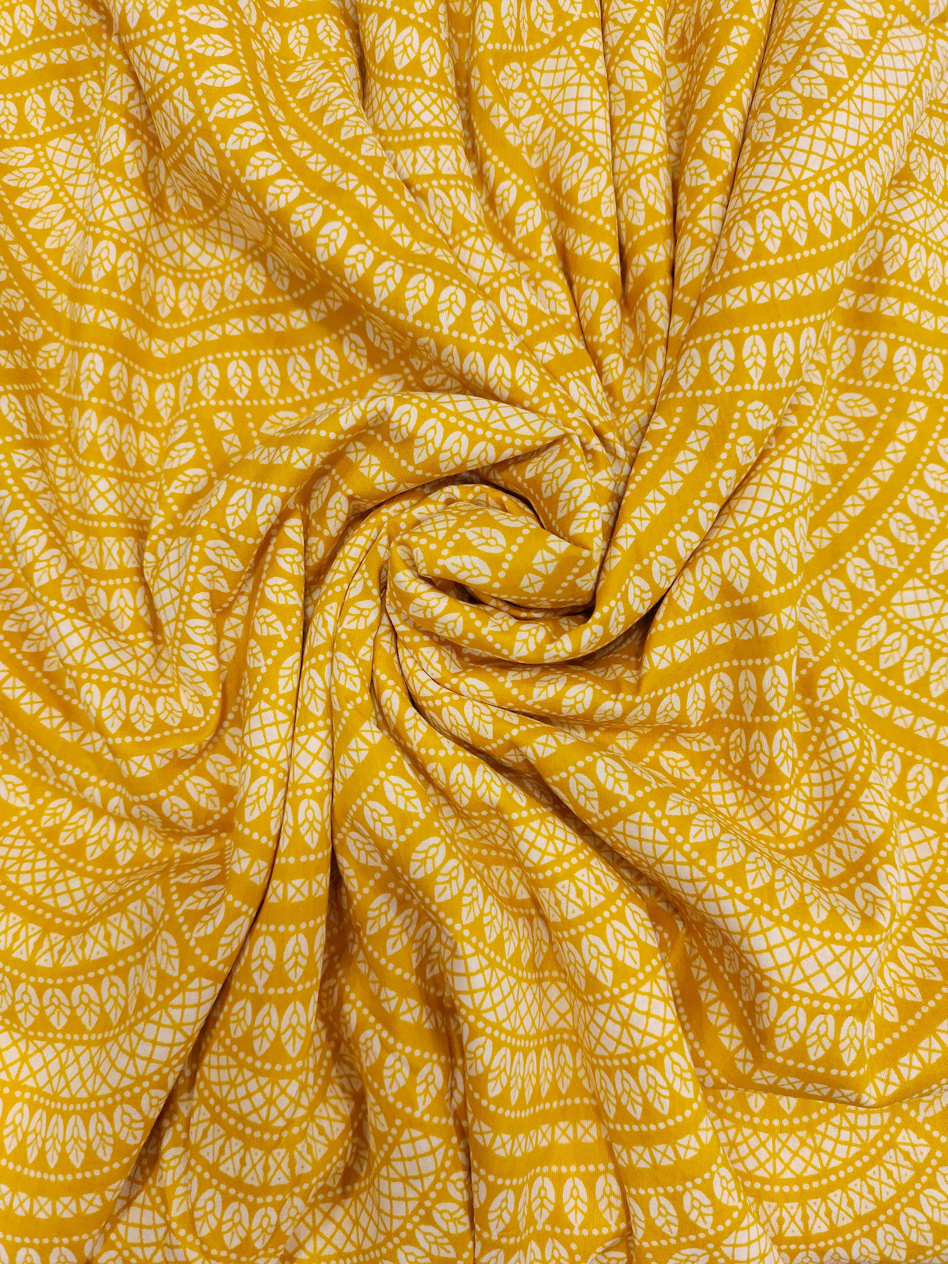 Yellow cotton half circular print.