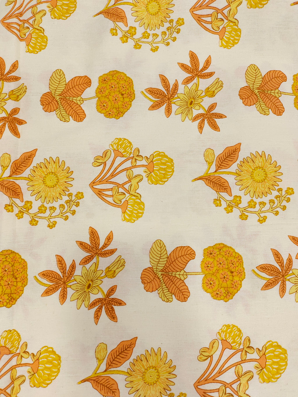 Cotton flex printed with orange and yellow floral print.