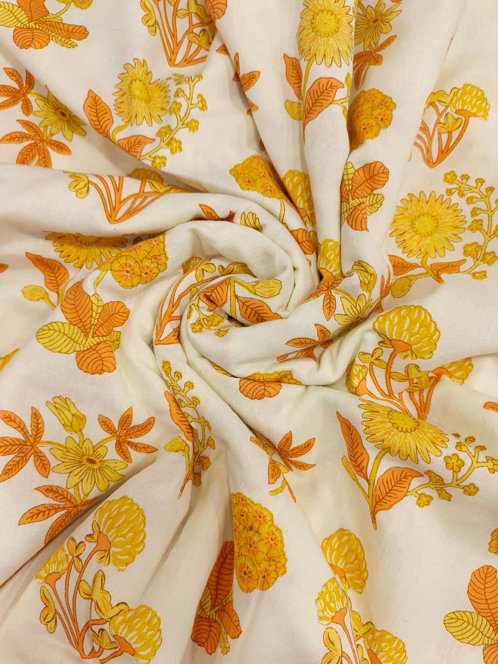Cotton flex printed with orange and yellow floral print.