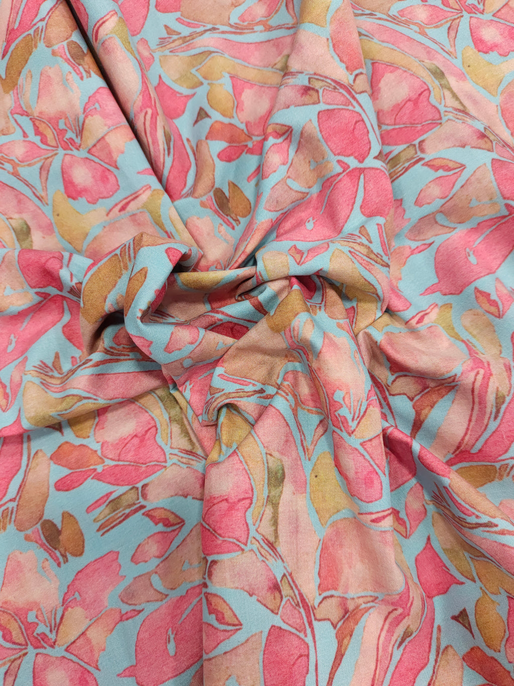 Cotton digital print on blueish green fabric withtomato and peach color.