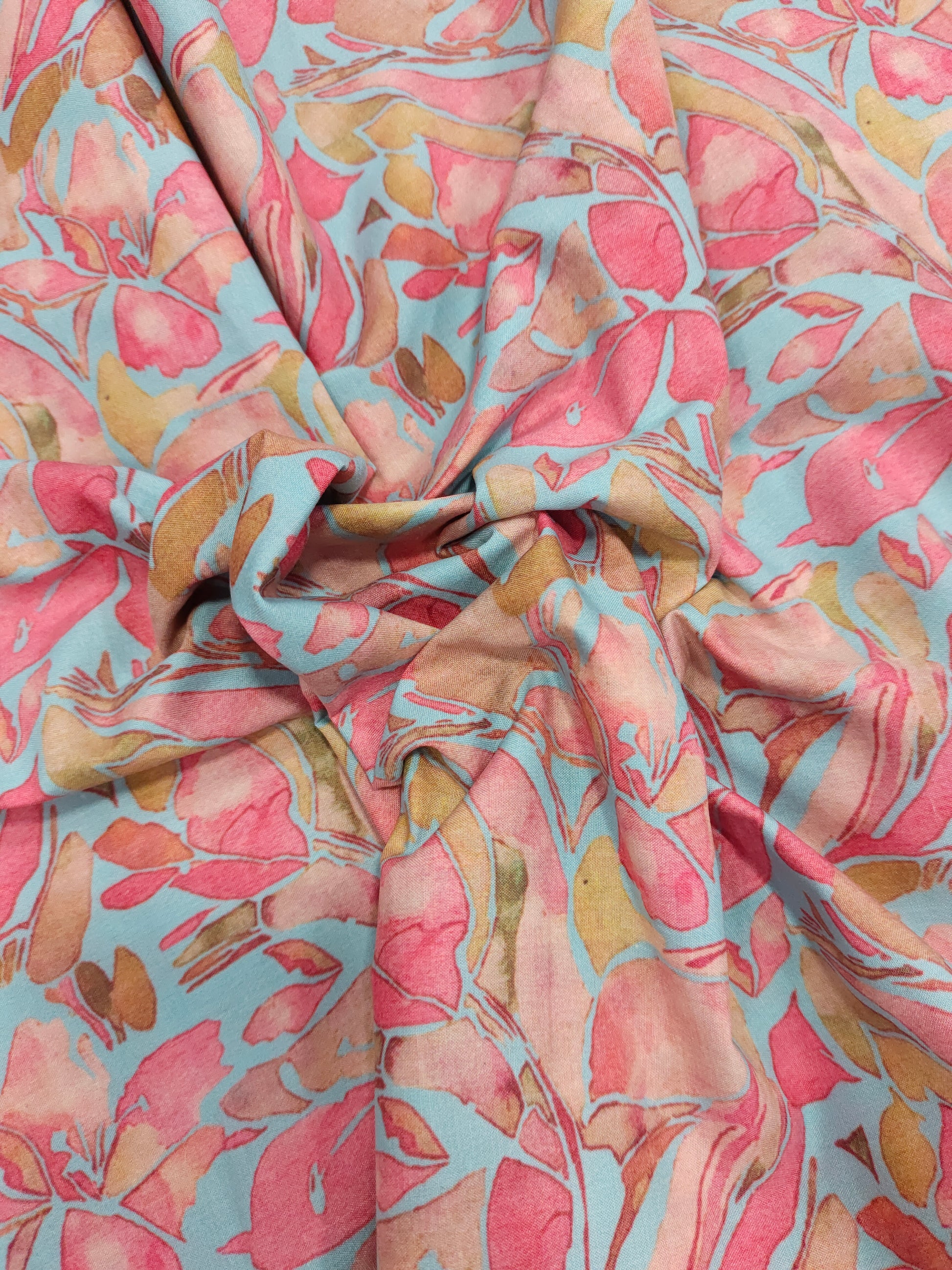 Cotton digital print on blueish green fabric withtomato and peach color.