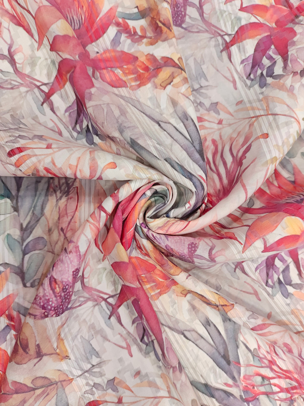 Polycot jacquard digital print with red grey and green.