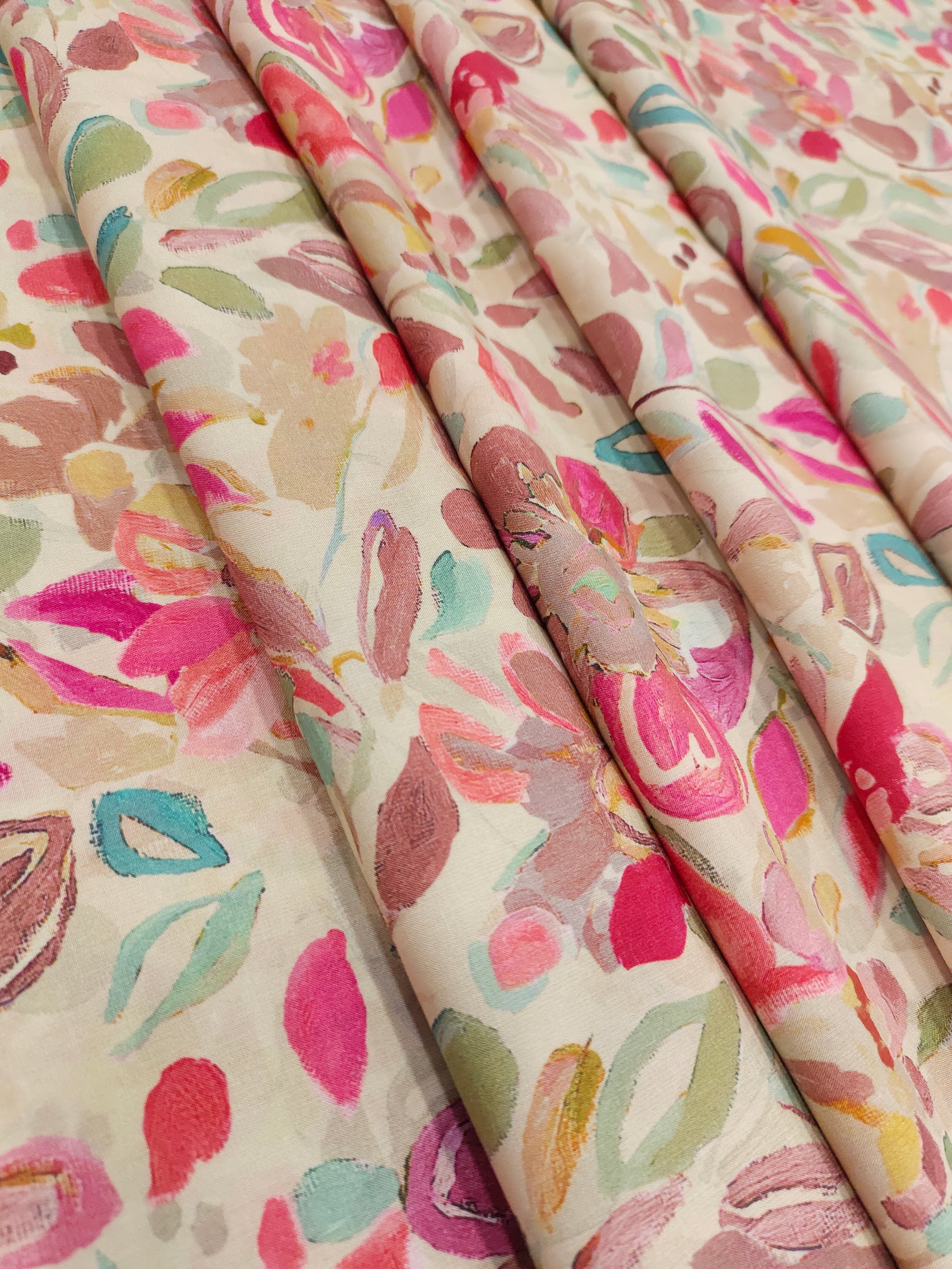 Modal silk digital print with shades of pink and green.