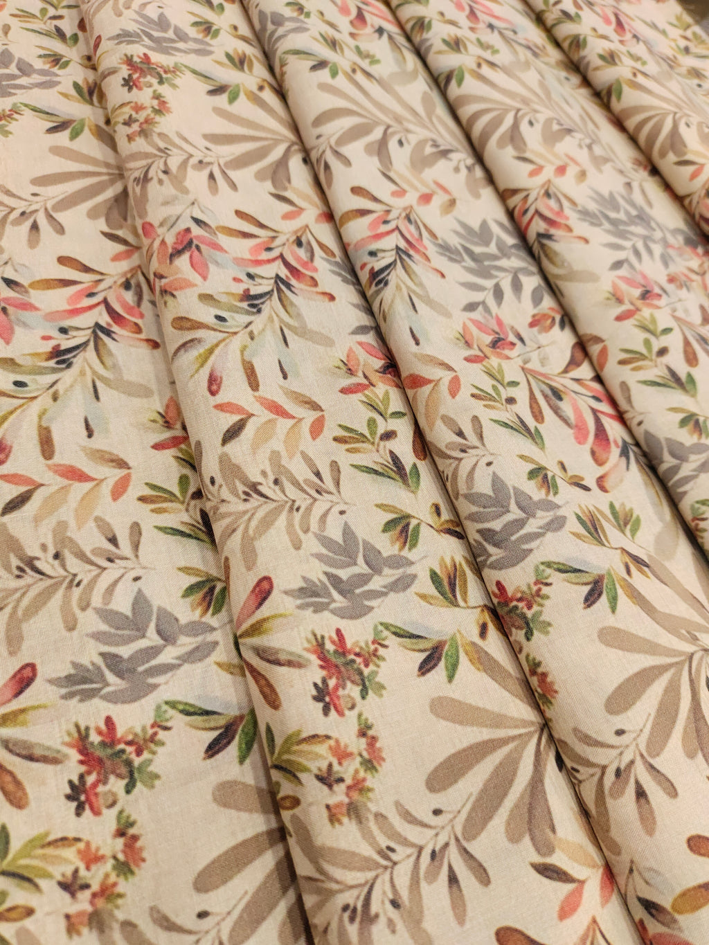 Beige cotton digital print with red light brown and grey.