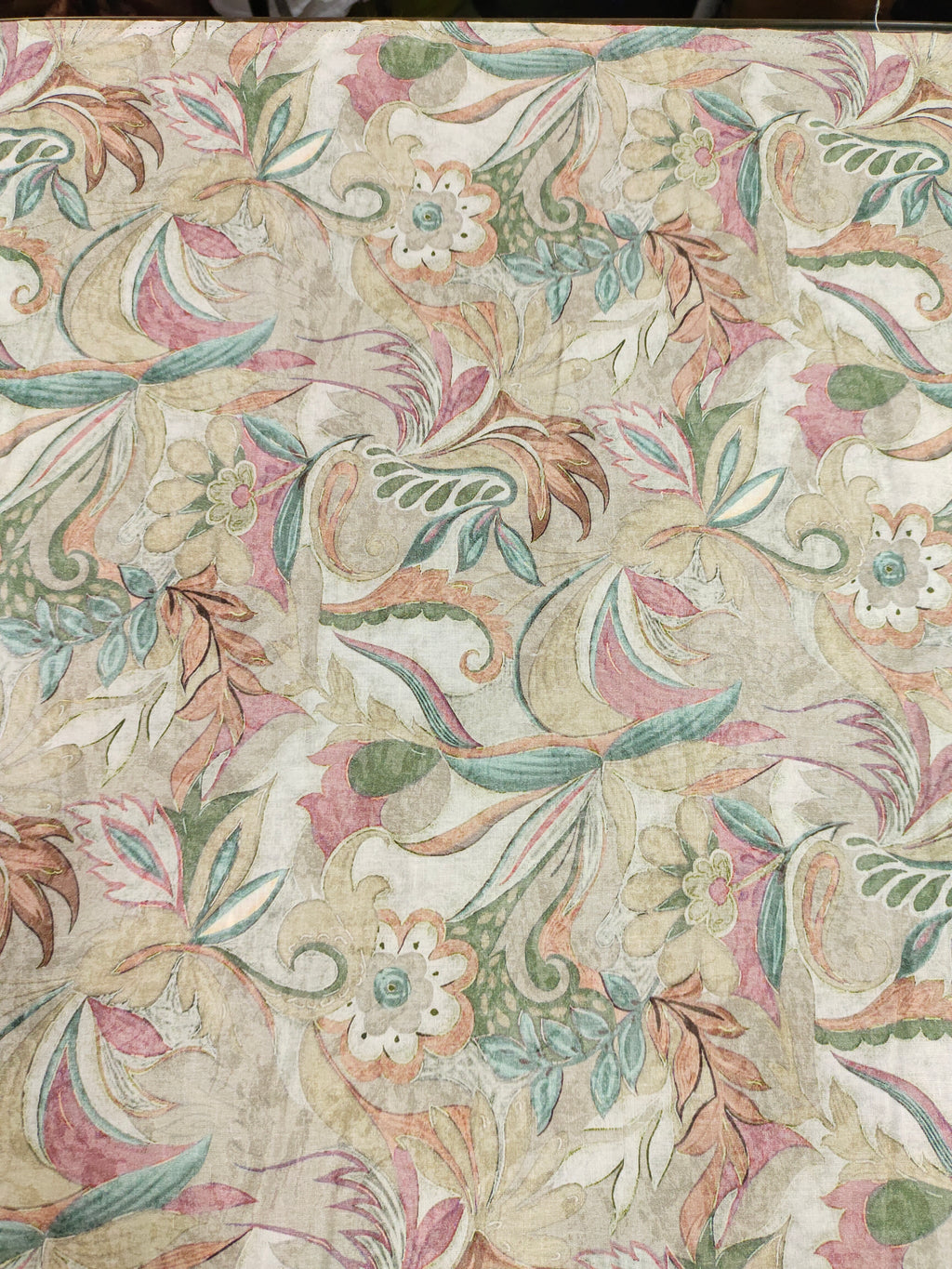 Cotton digital printed fabric with floral colors of pink green and beige.