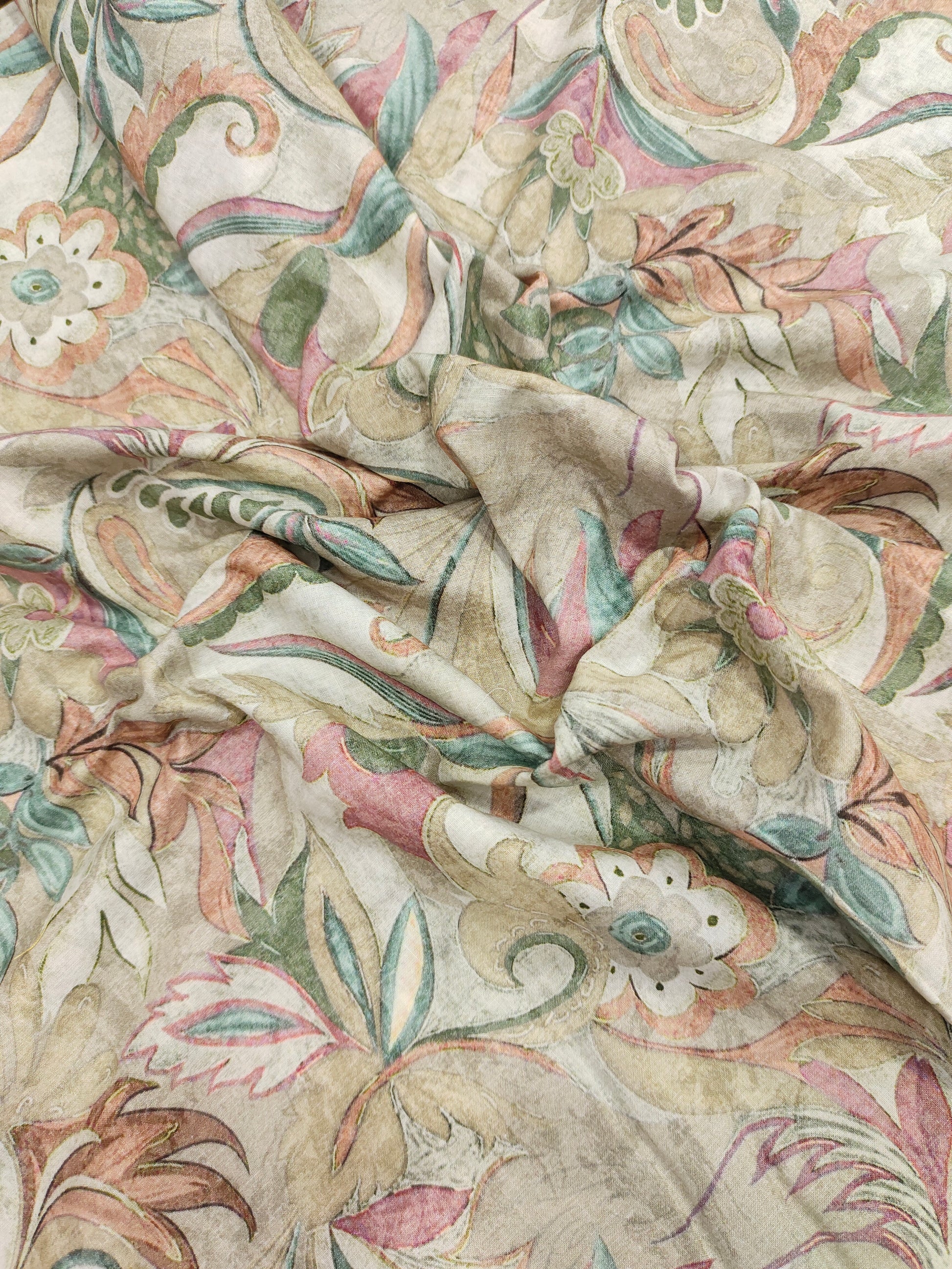 Cotton digital printed fabric with floral colors of pink green and beige.
