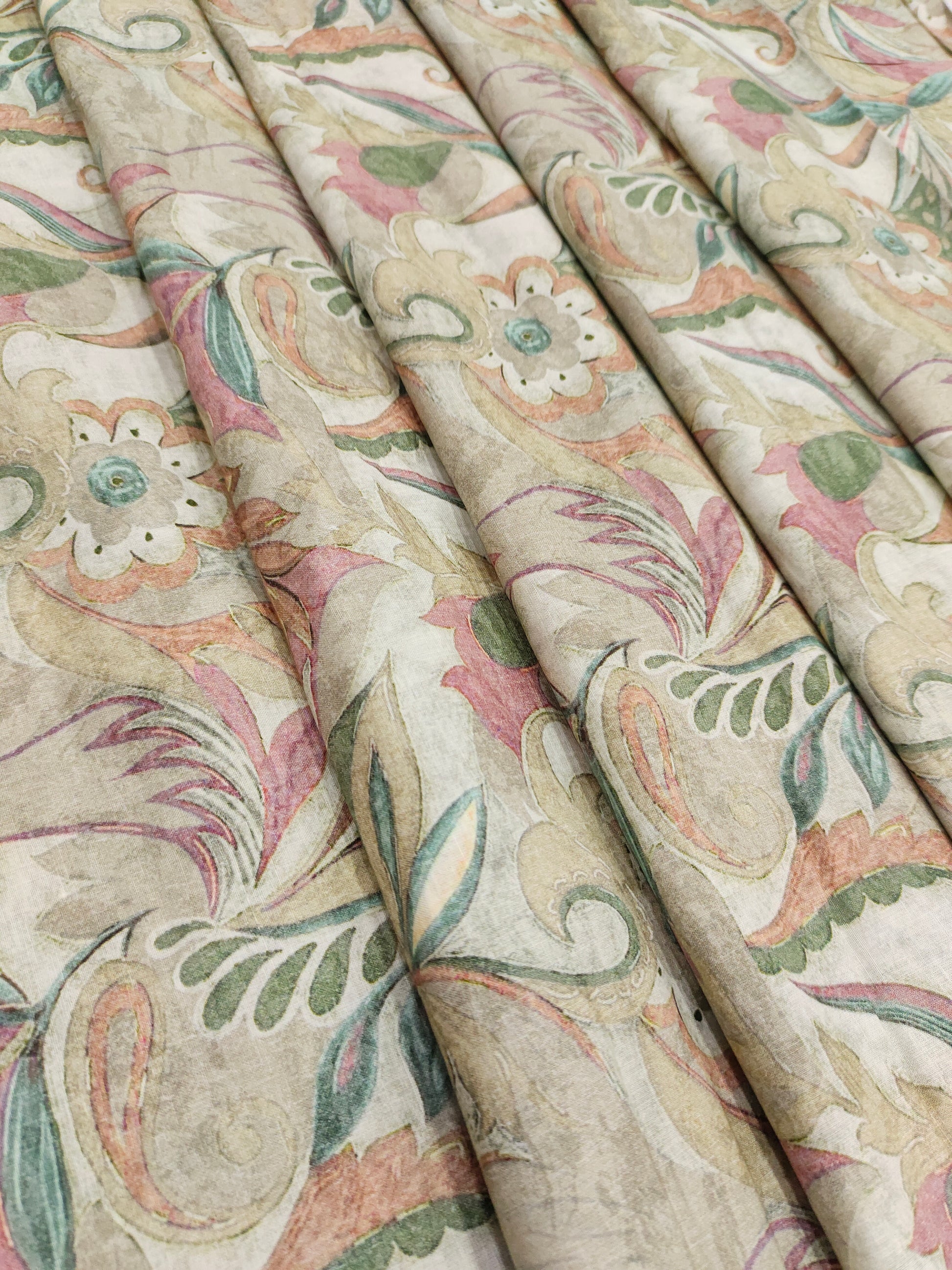 Cotton digital printed fabric with floral colors of pink green and beige.