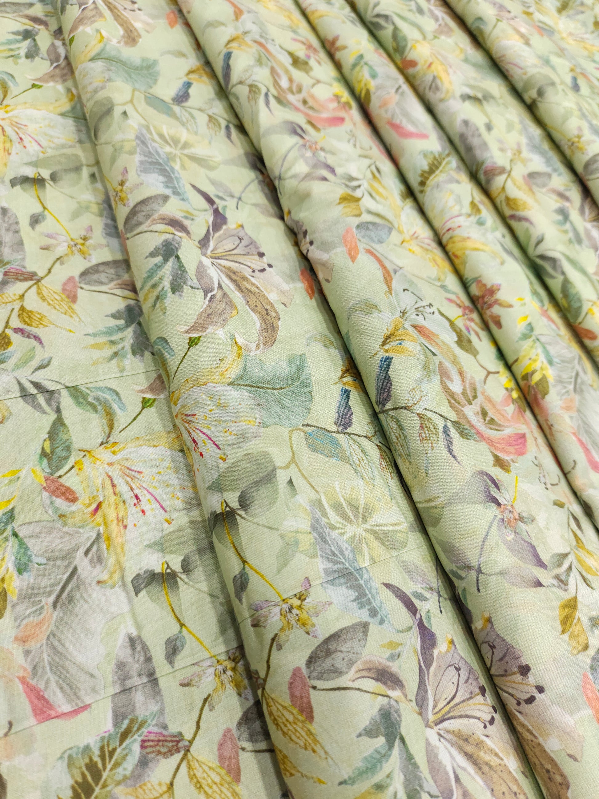 Light pista green pure cotton digital print fabric with yellow green and peach.