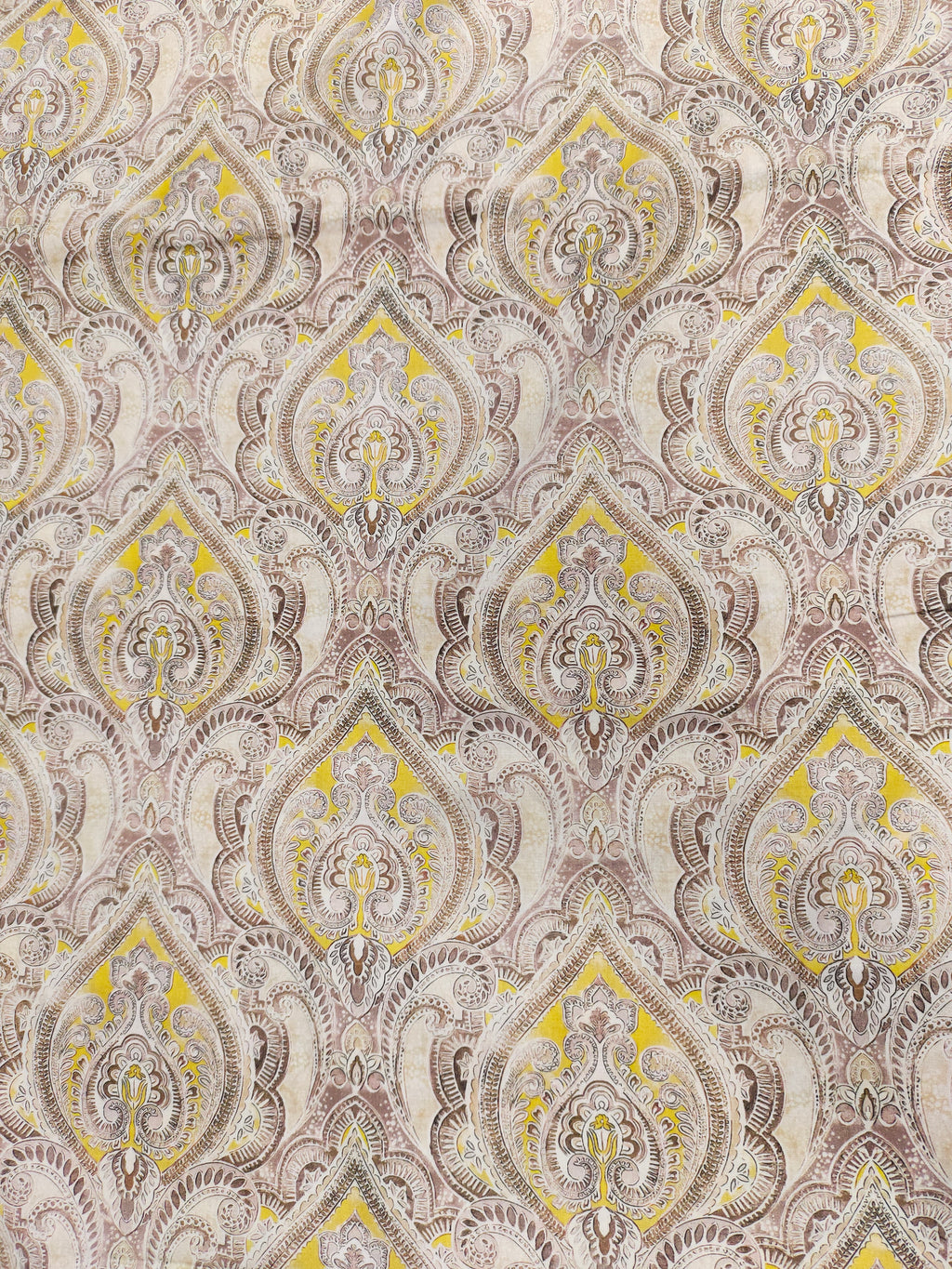 Pure cotton digital print with yellow and brown leaves pattern.