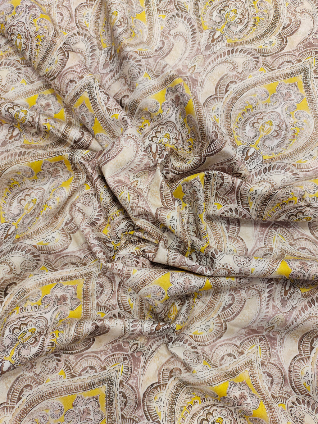 Pure cotton digital print with yellow and brown leaves pattern.