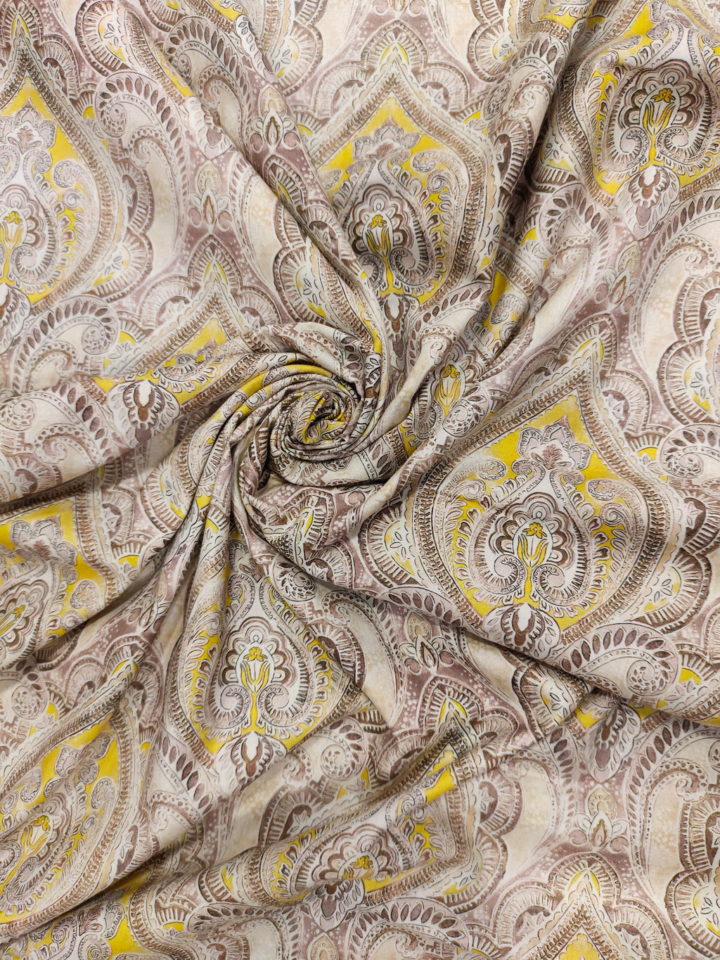 Pure cotton digital print with yellow and brown leaves pattern.