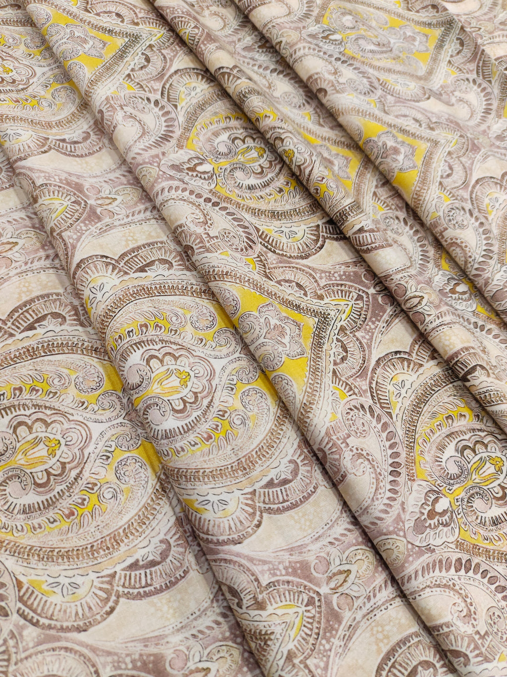 Pure cotton digital print with yellow and brown leaves pattern.