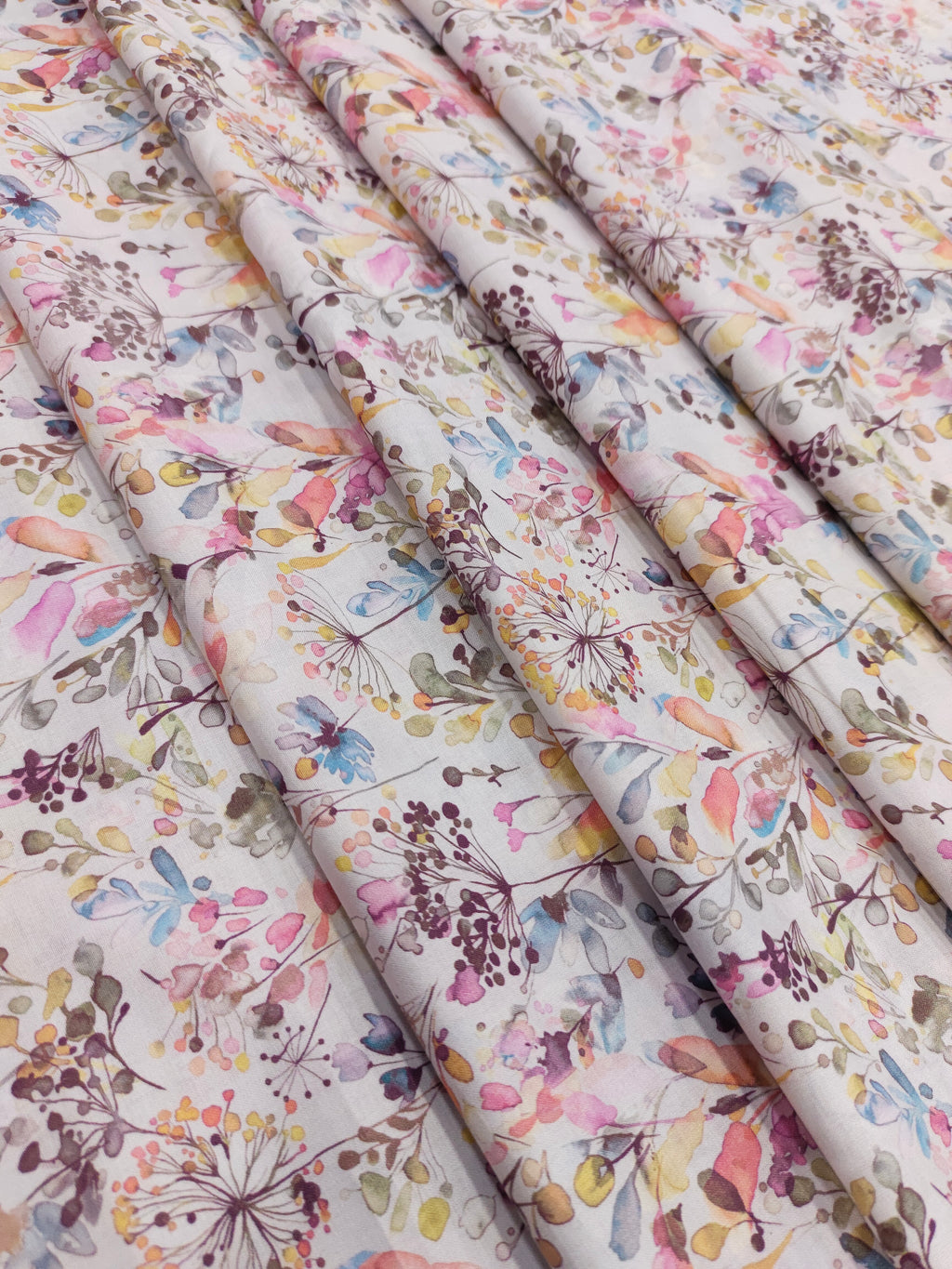 Cotton digital small all over print with pink blue and mauve.