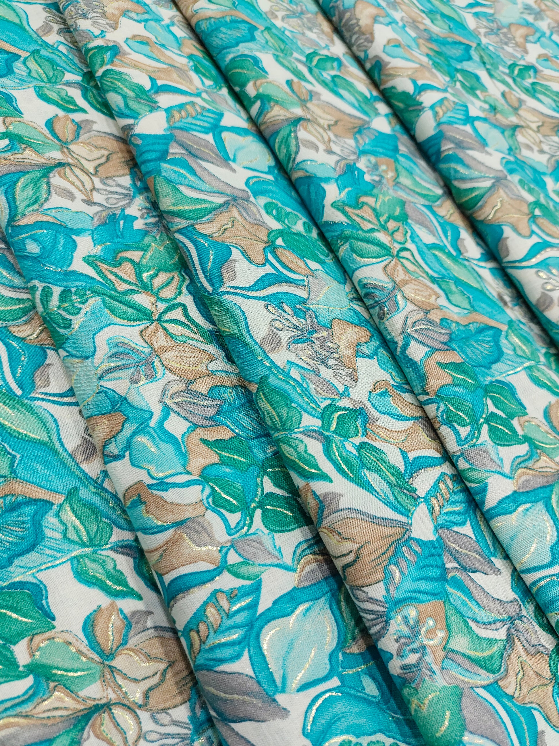Cotton blue green mill print with gold foile.