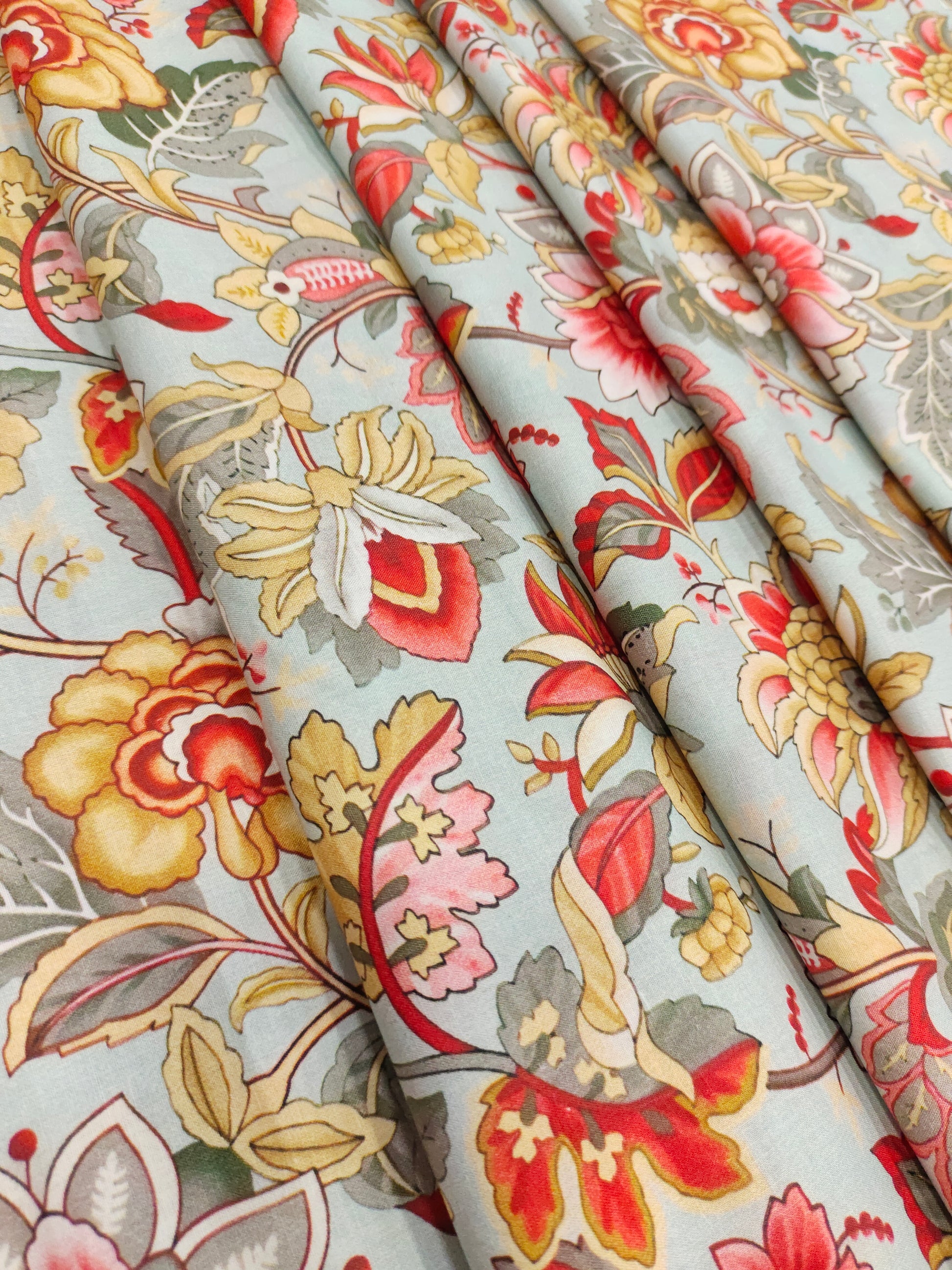 Cotton digital print with red beige and grey.