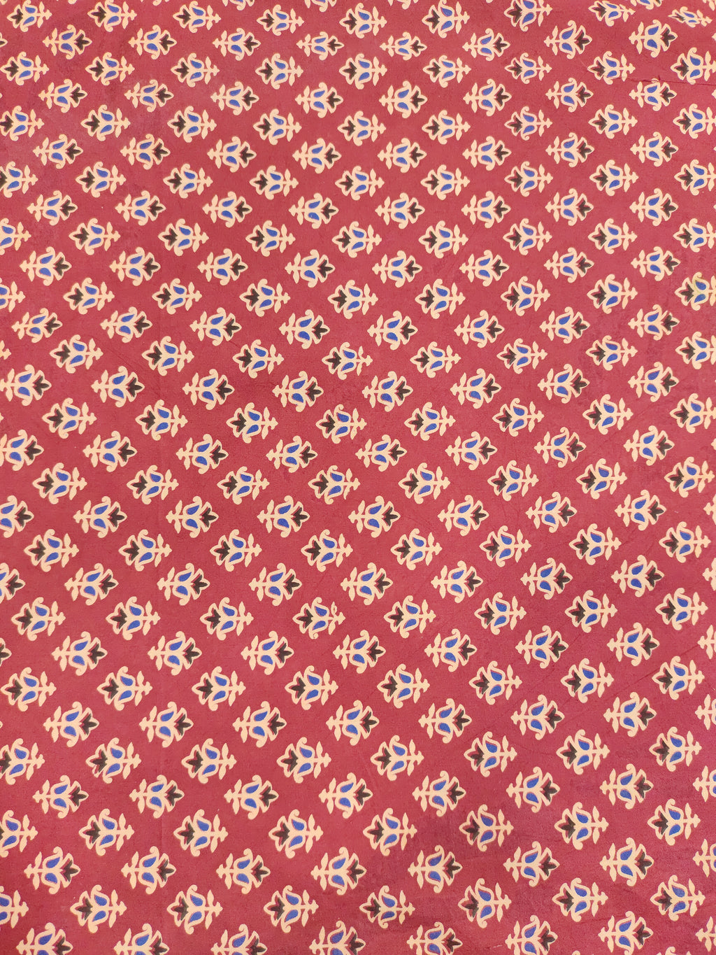 Maroon base cotton small ajrak butti fabric.