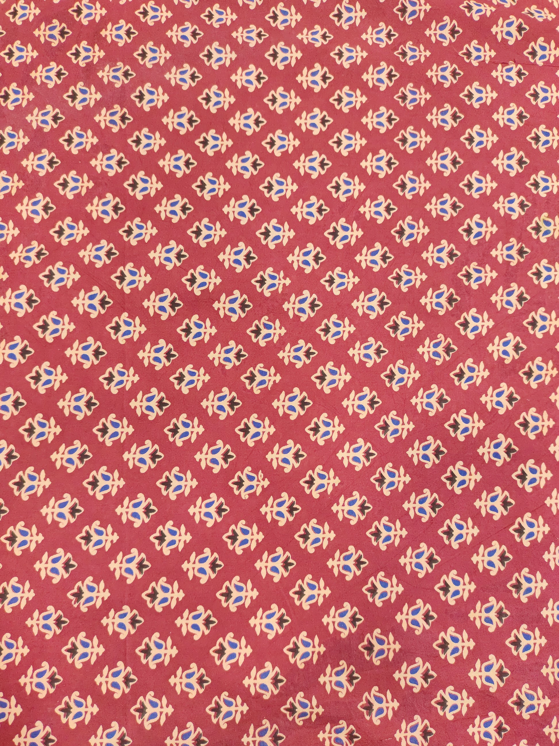 Maroon base cotton small ajrak butti fabric.