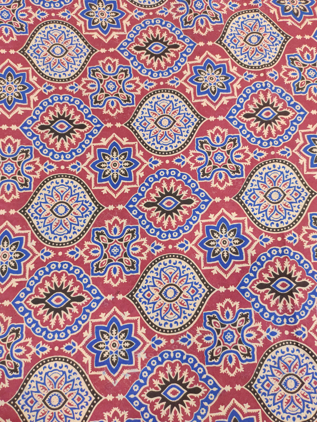 Maroon base ajrak print with blue black and beige.
