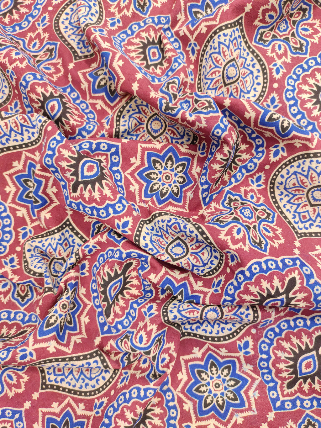 Maroon base ajrak print with blue black and beige.