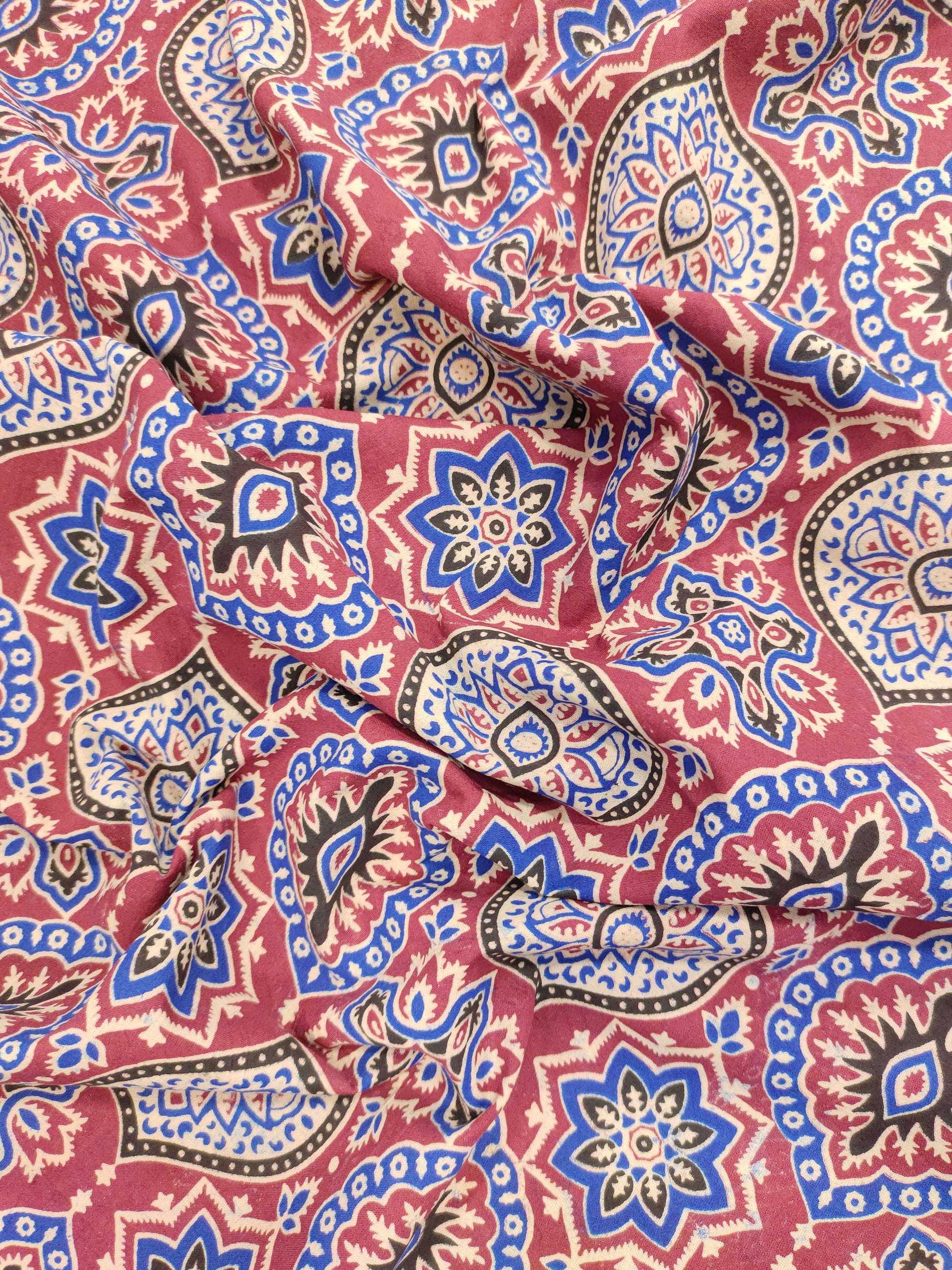 Maroon base ajrak print with blue black and beige.