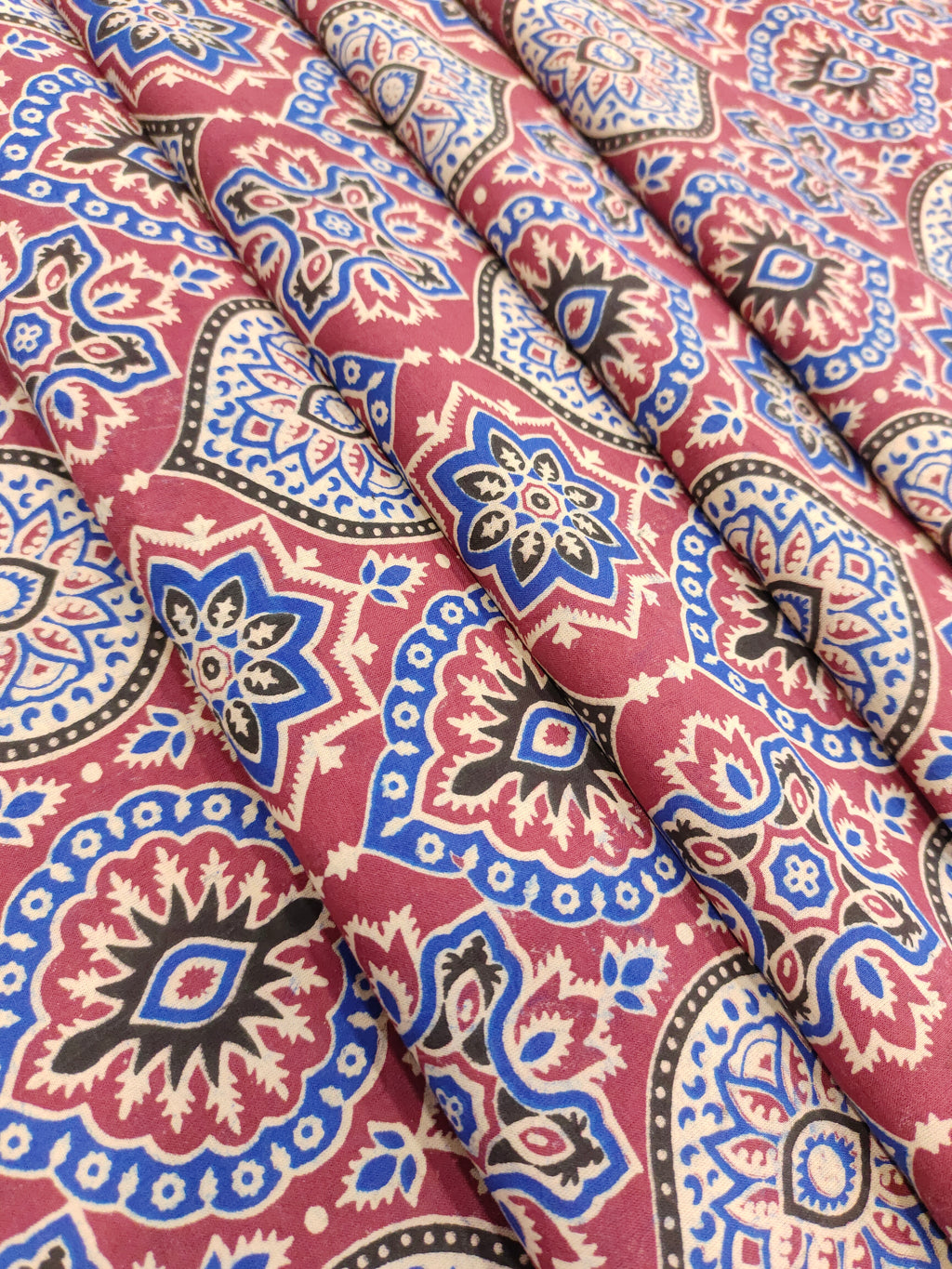 Maroon base ajrak print with blue black and beige.