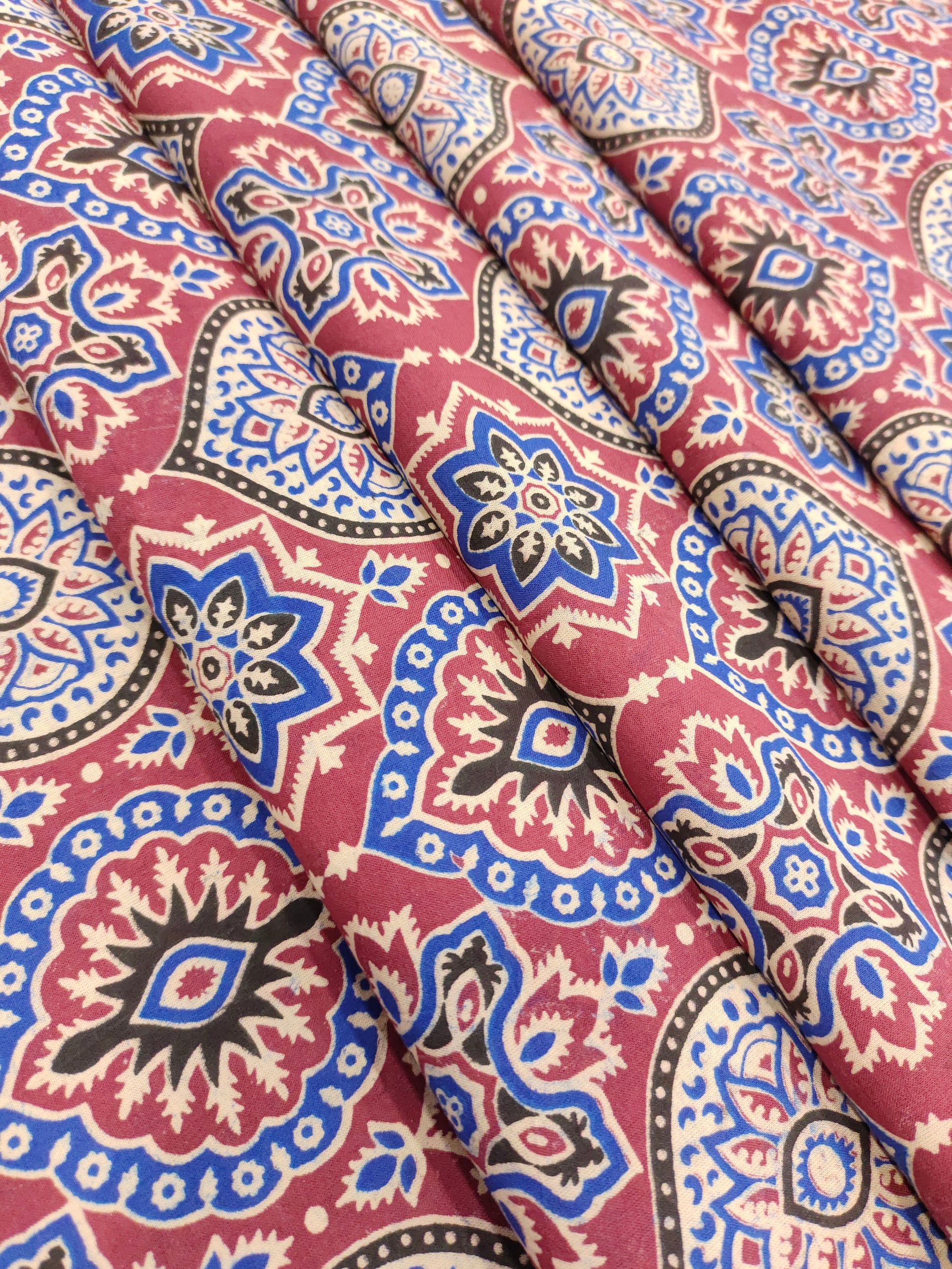 Maroon base ajrak print with blue black and beige.
