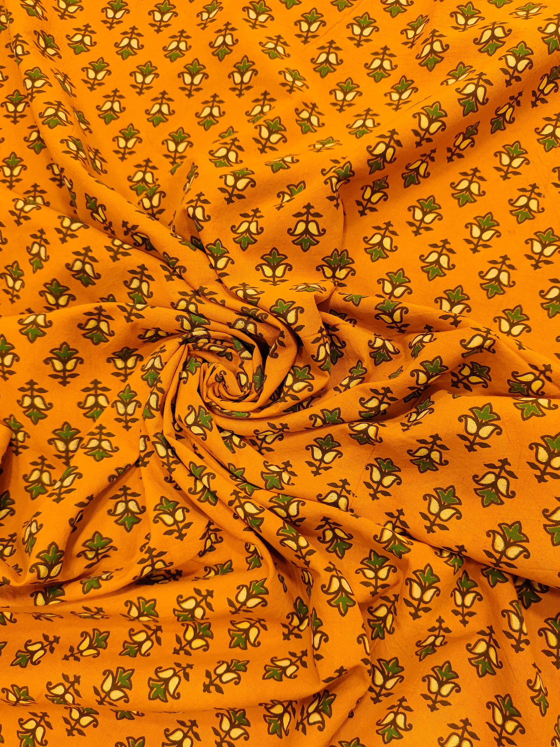 Mustard ajrak print with green and yellow small butti.