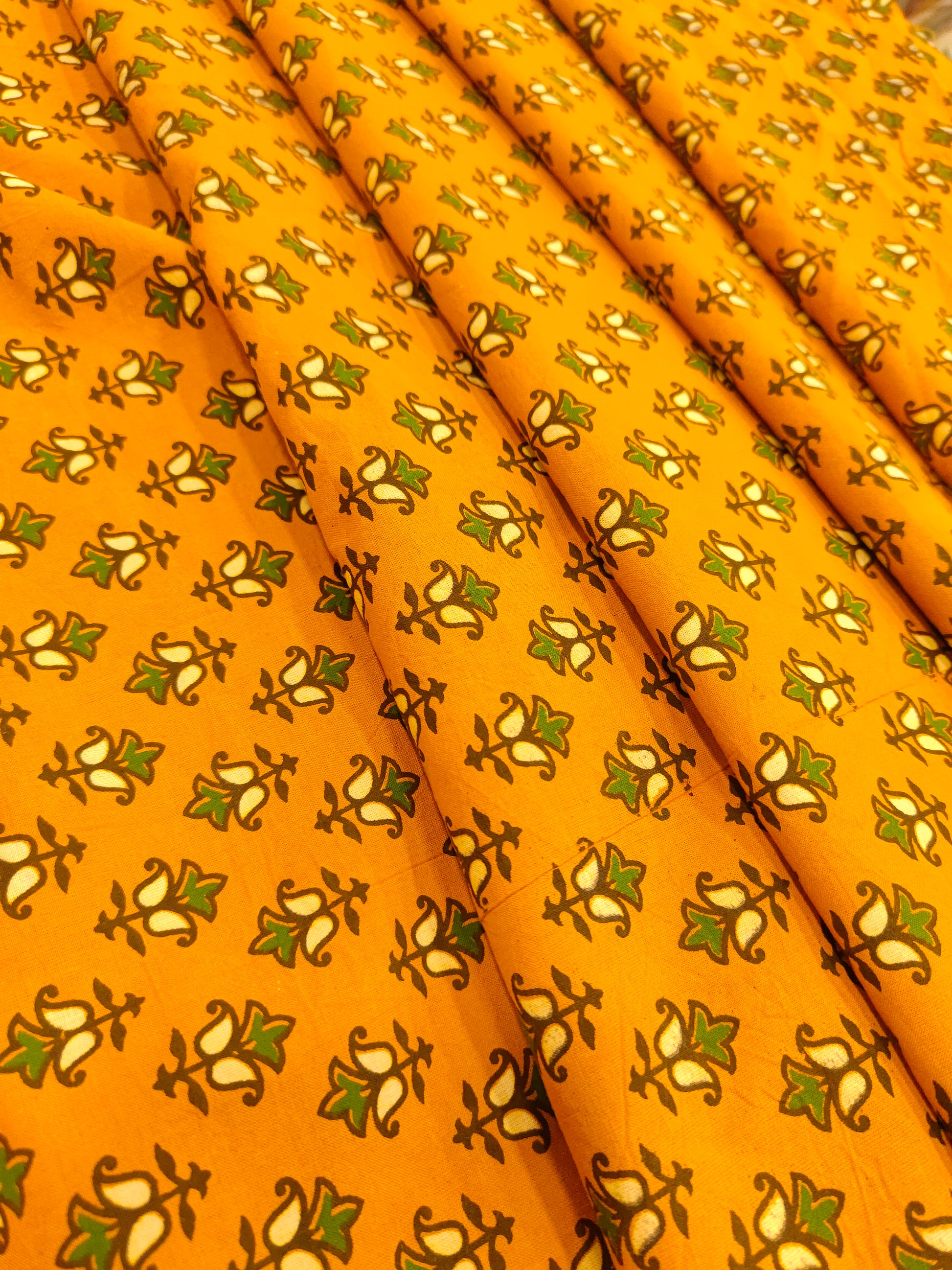 Mustard ajrak print with green and yellow small butti.