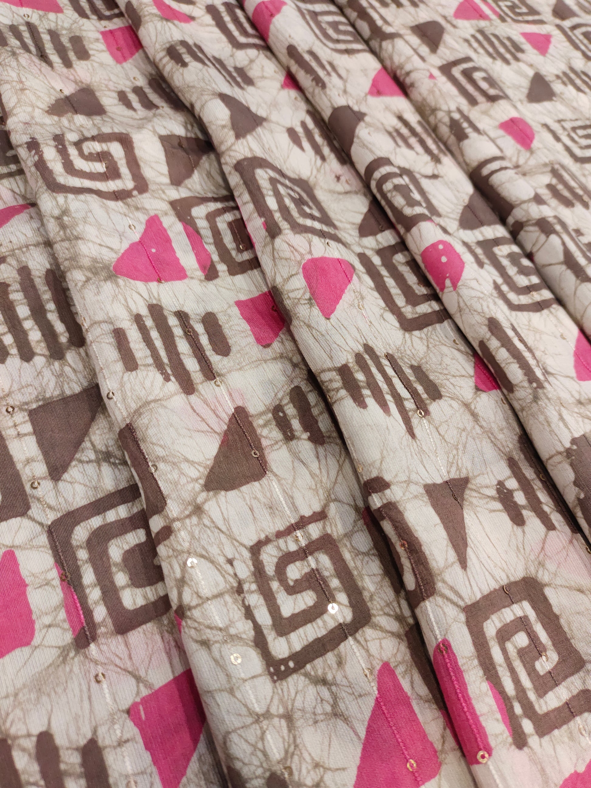 Chanderi silk batiq print with chocolate color and pink with little sequins.