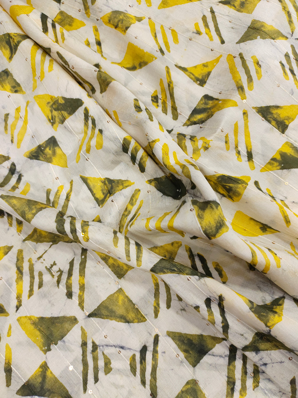 Chanderi silk batiq print with yellow and green.