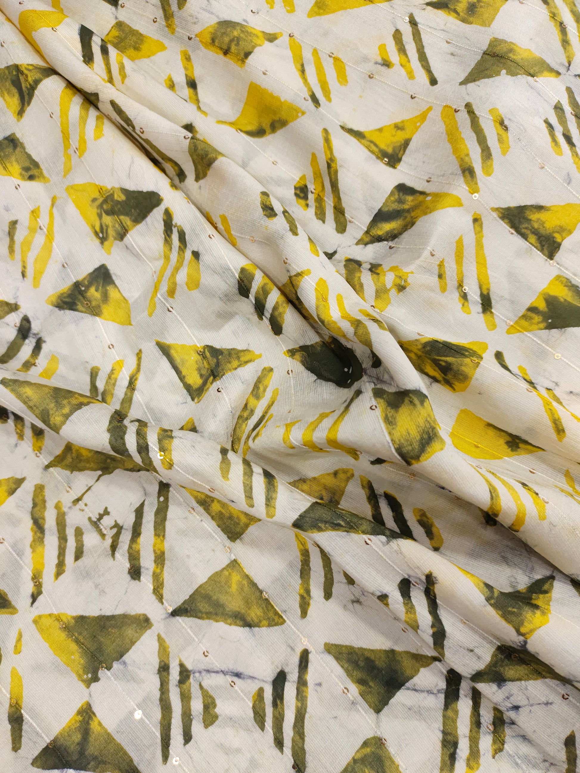 Chanderi silk batiq print with yellow and green.