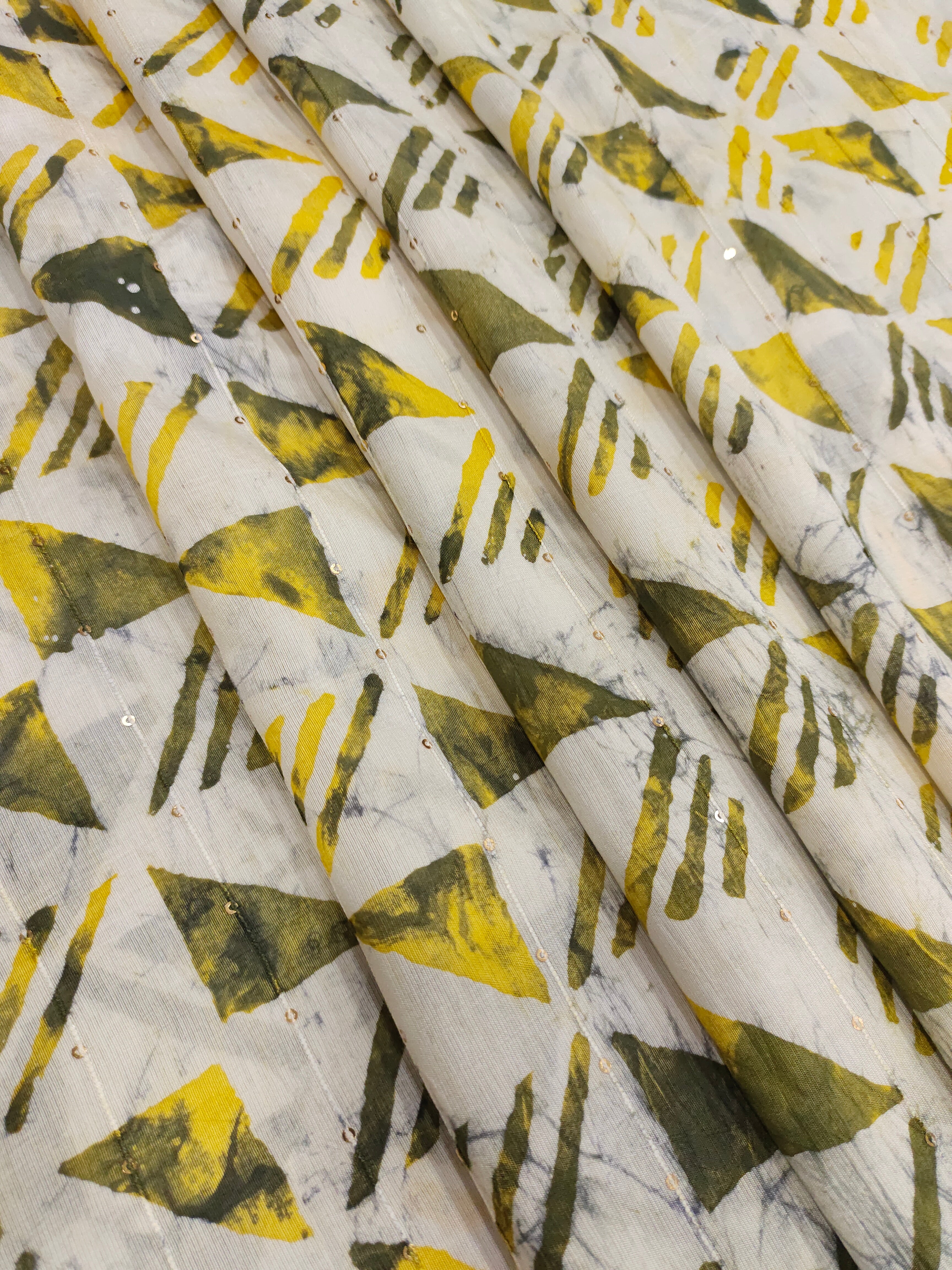 Chanderi silk batiq print with yellow and green.