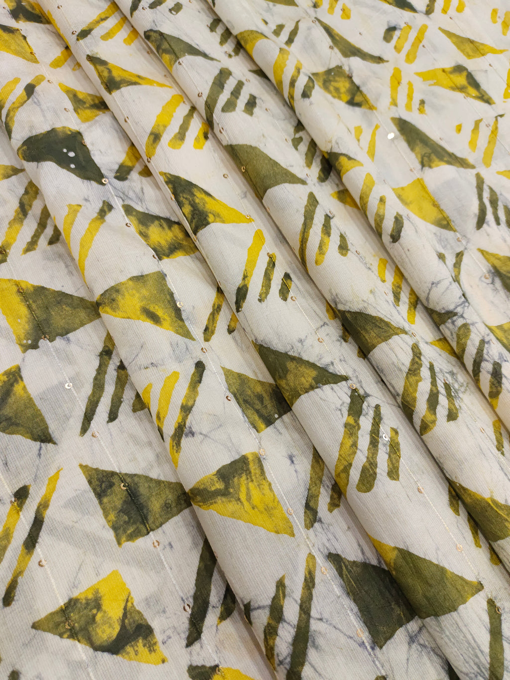 Chanderi silk batiq print with yellow and green.