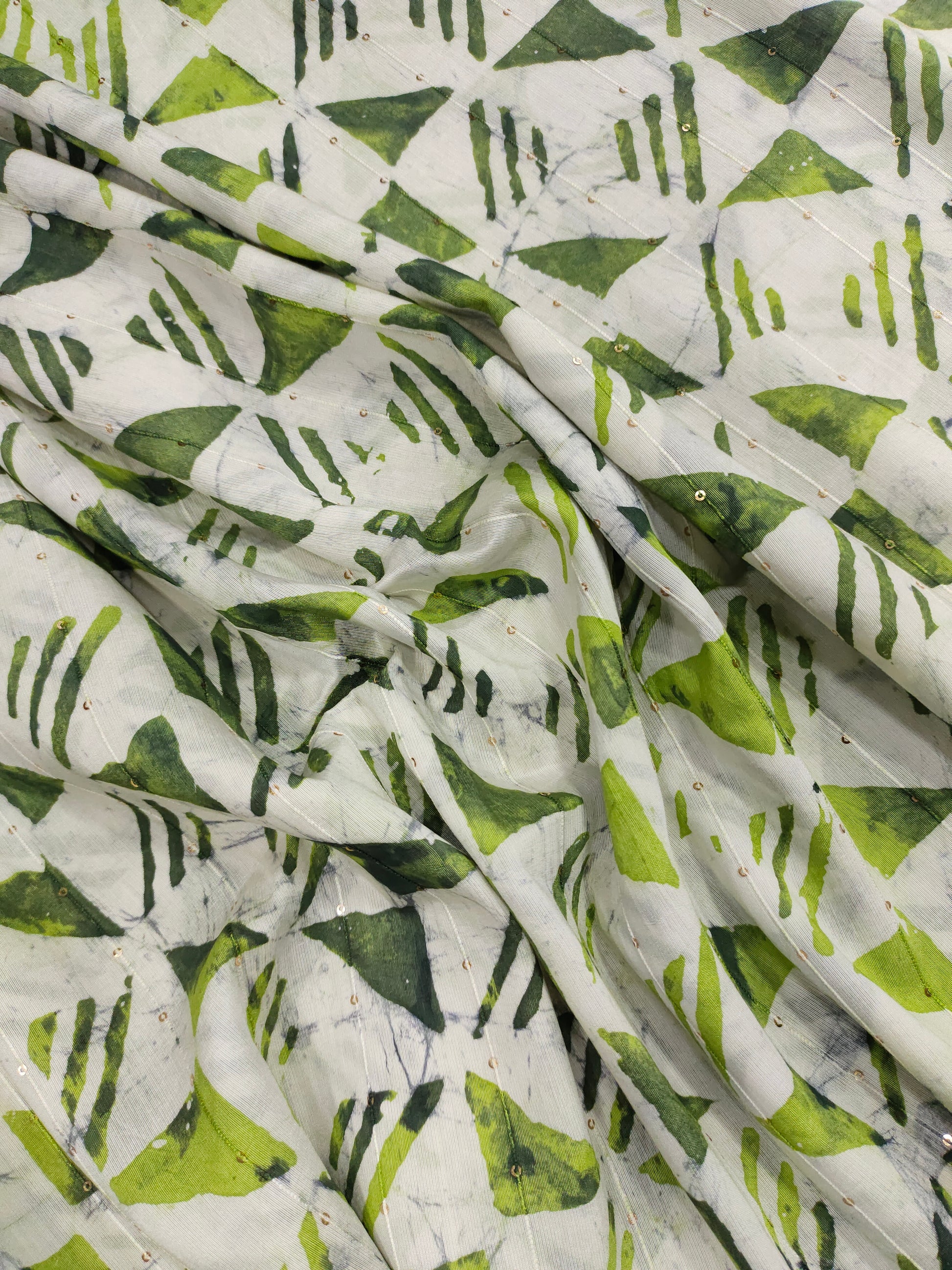 Chanderi silk batiq print with 2 shades of green and gold sequins.