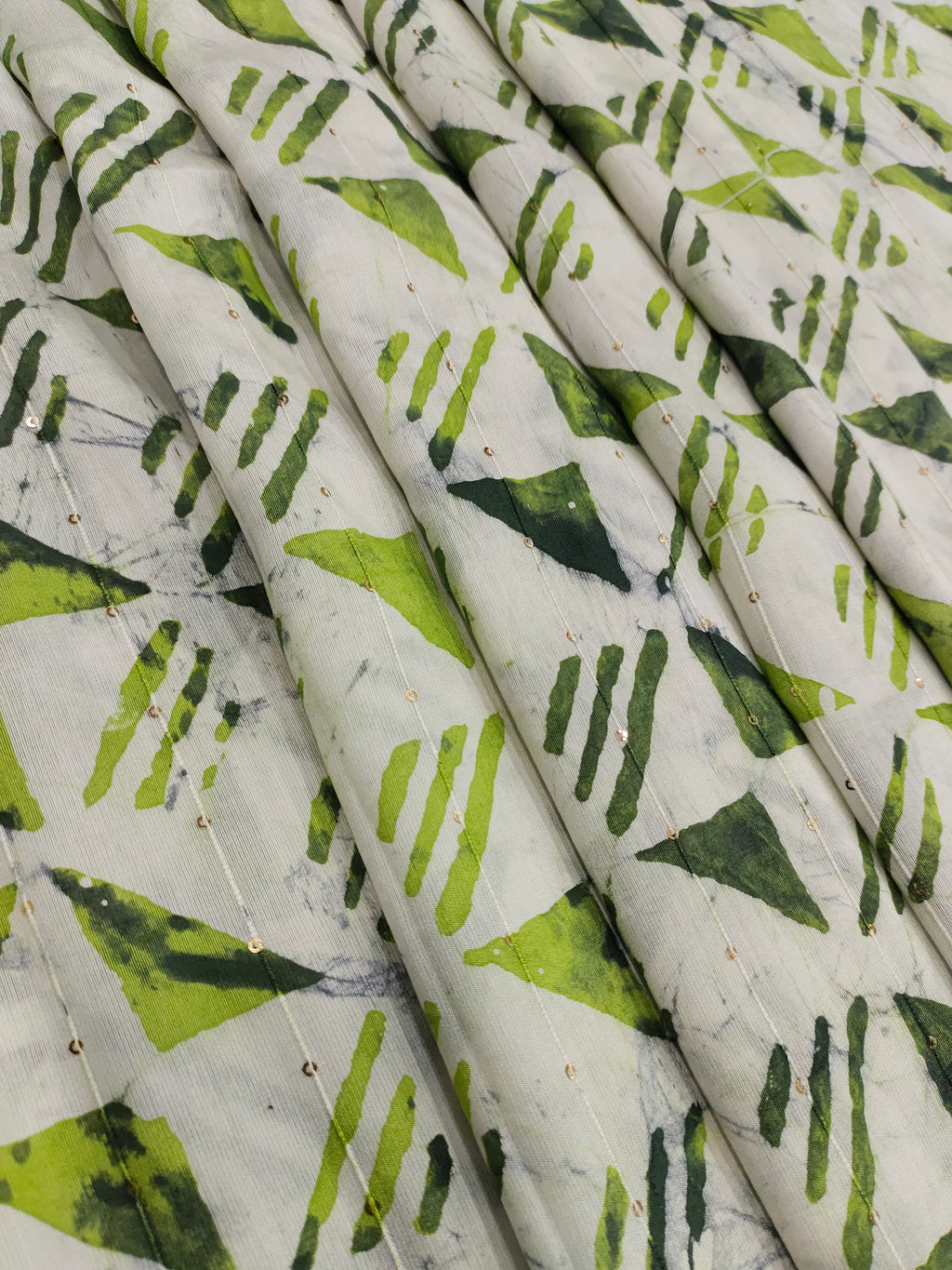 Chanderi silk batiq print with 2 shades of green and gold sequins.