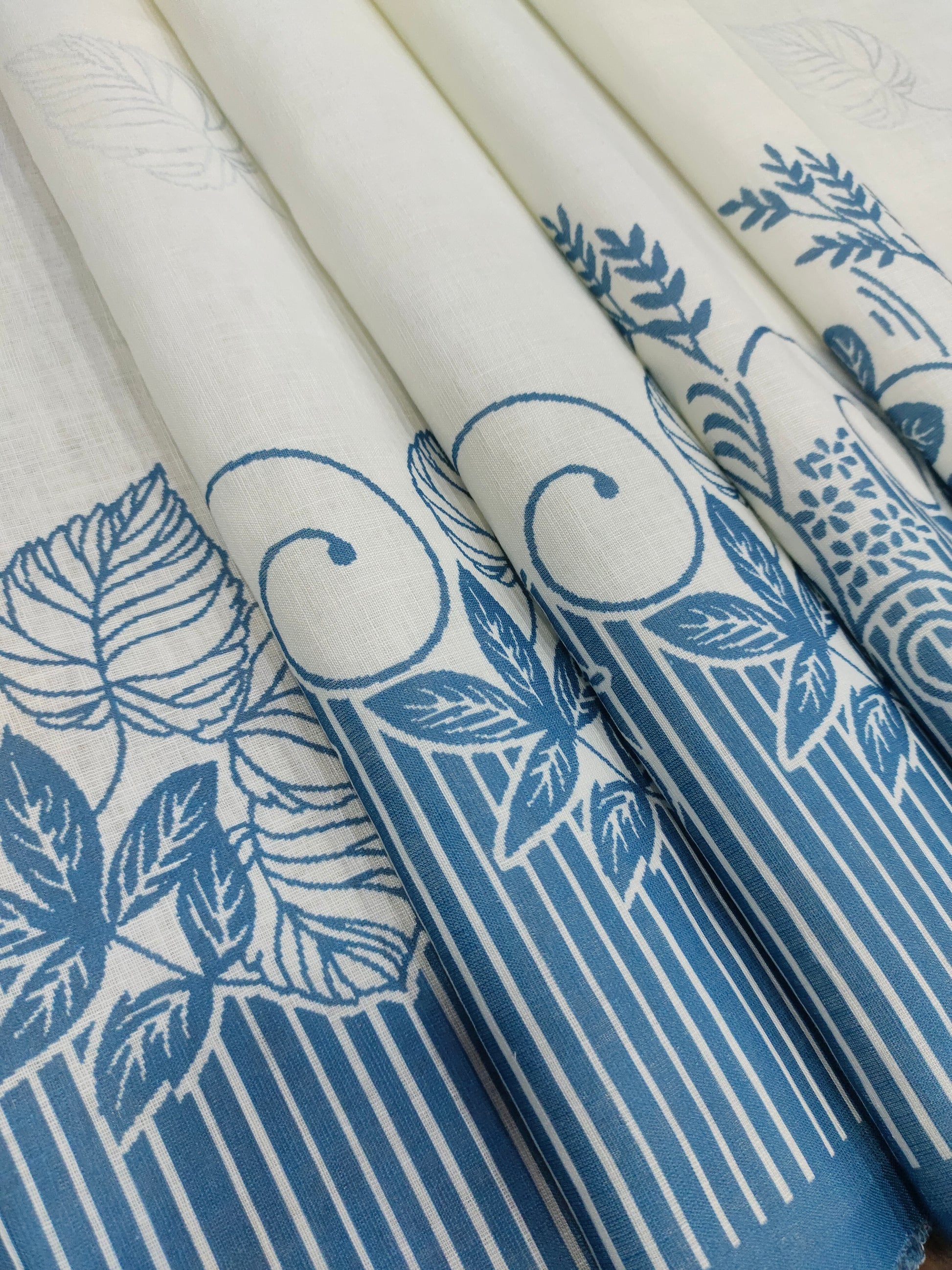 Offwhite base cotton linen fabric with blue daman print.