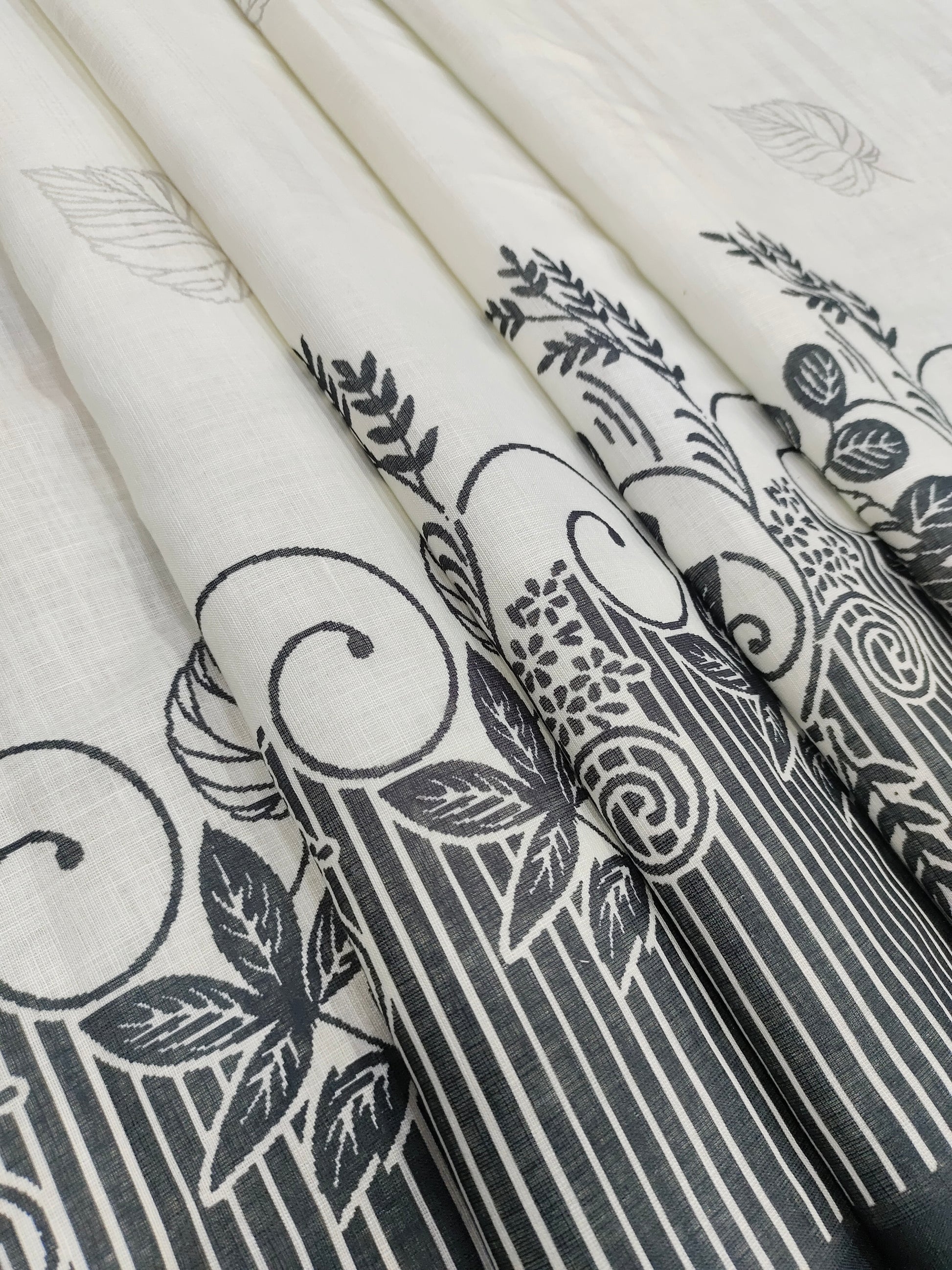 Offwhite base cotton linen fabric with black daman print.