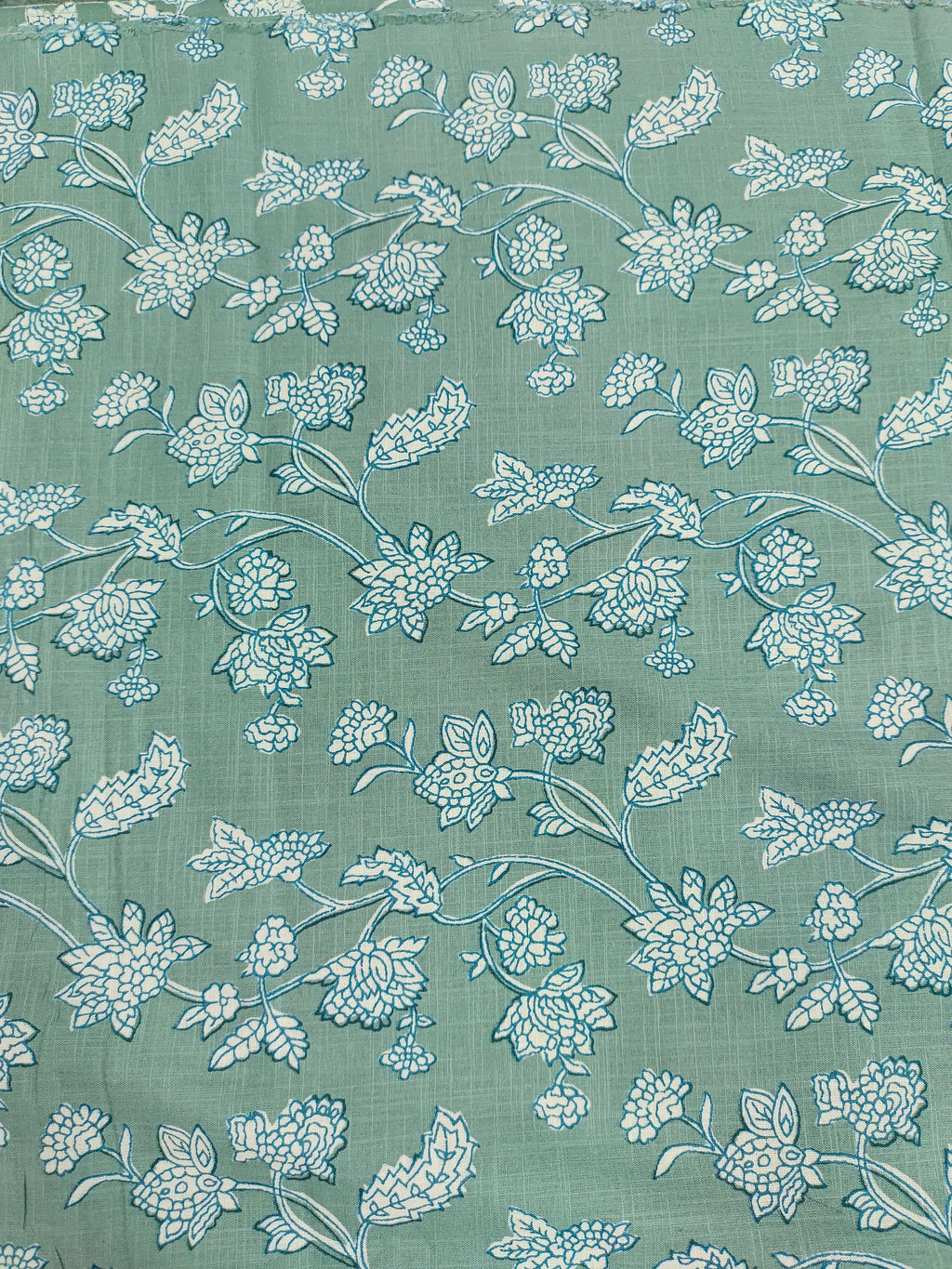 Green cotton slub printed fabric all over design.