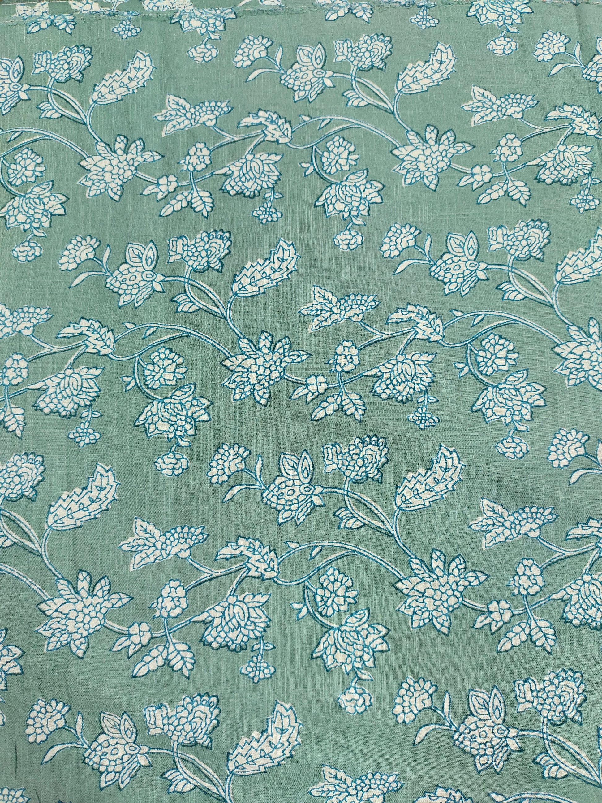 Green cotton slub printed fabric all over design.