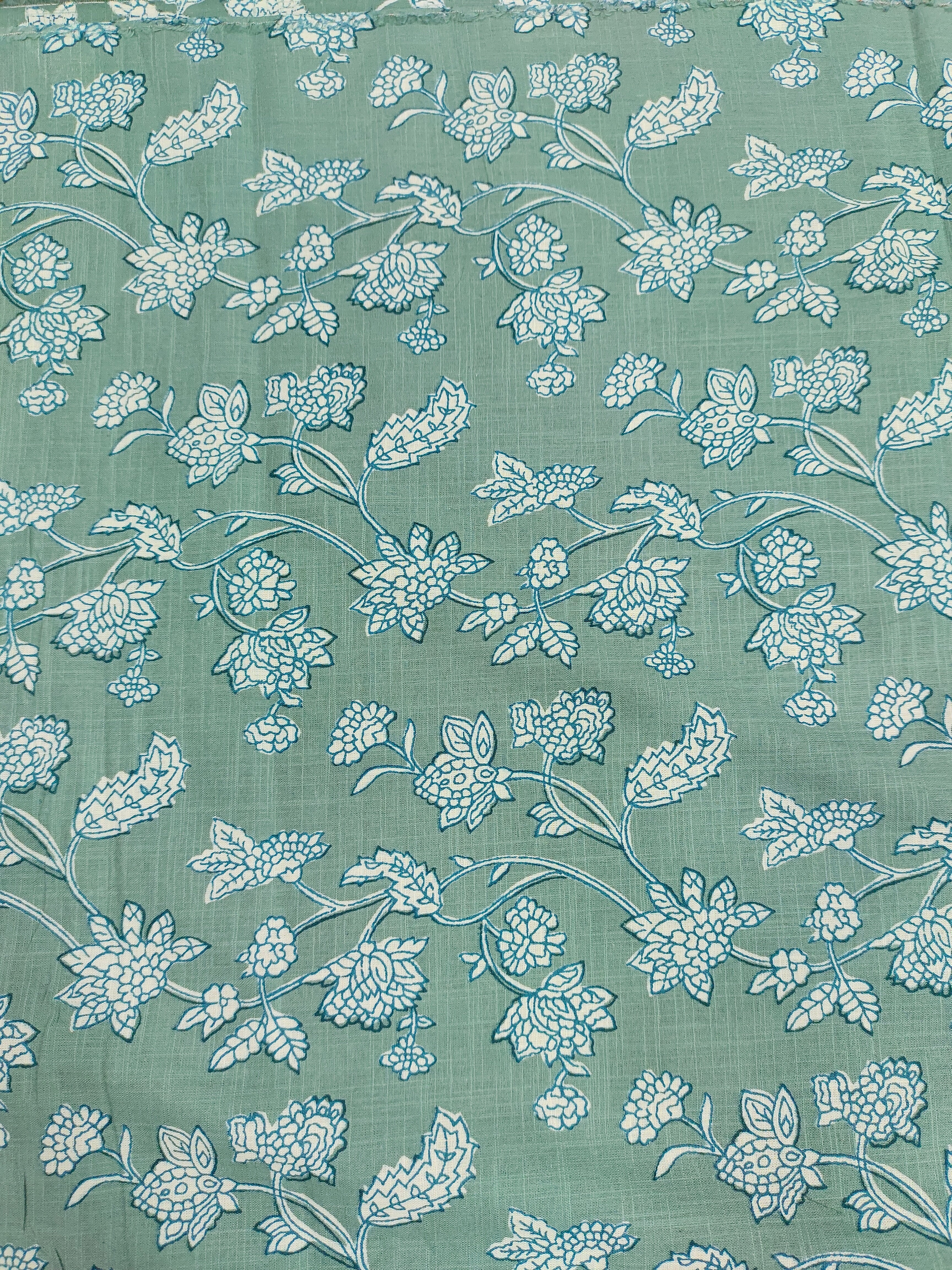 Green cotton slub printed fabric all over design.