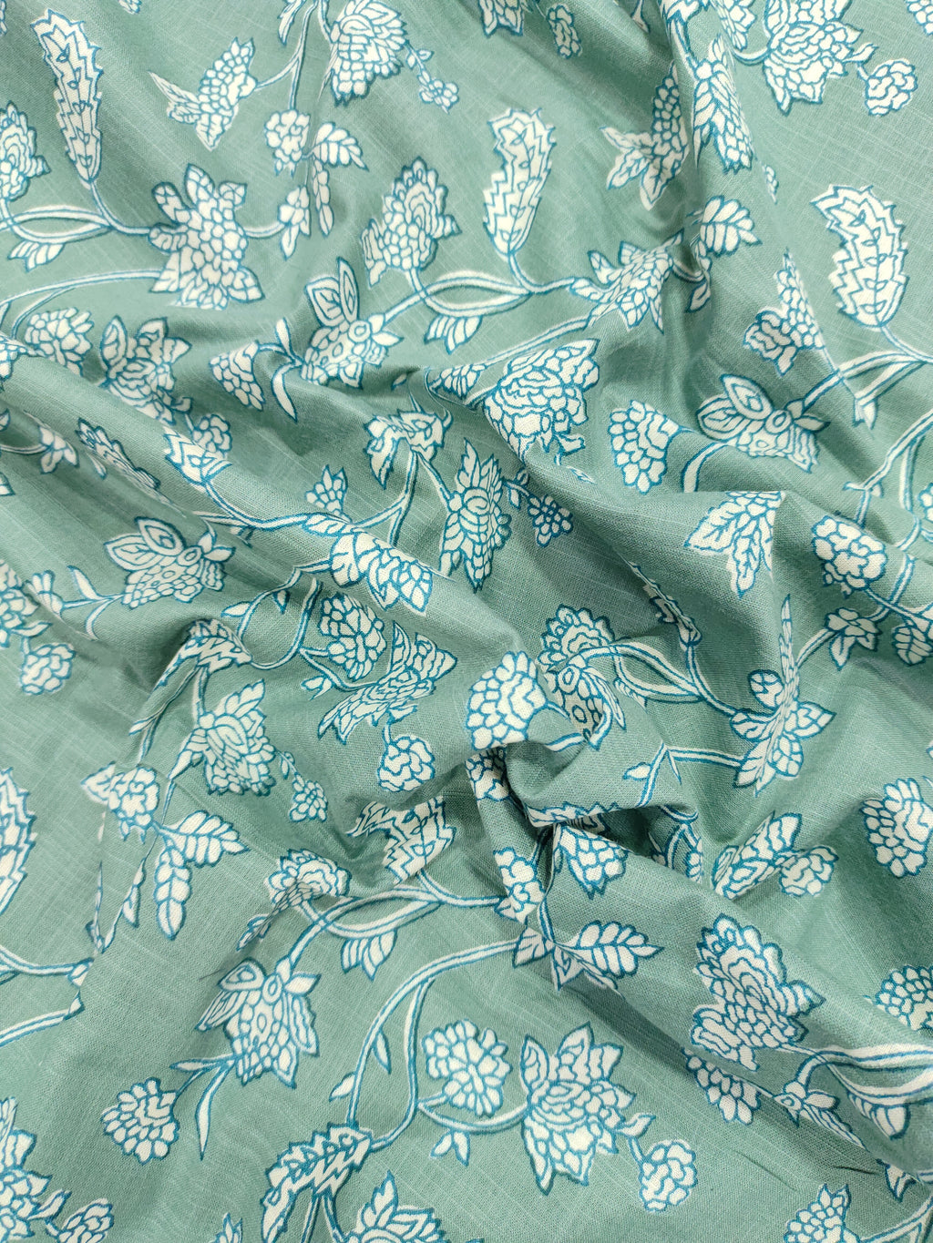 Green cotton slub printed fabric all over design.