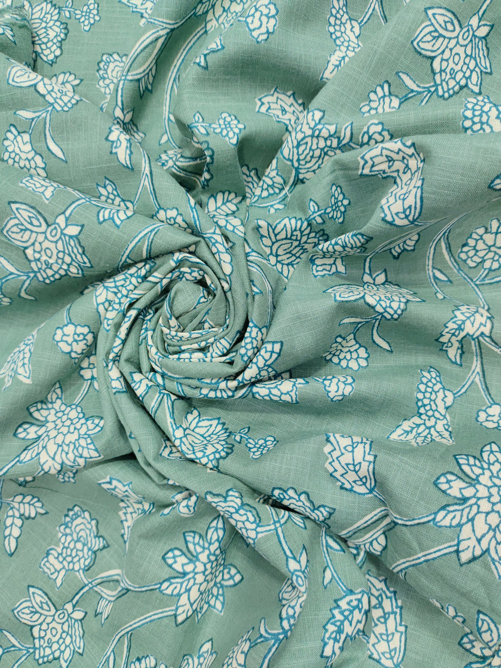 Green cotton slub printed fabric all over design.