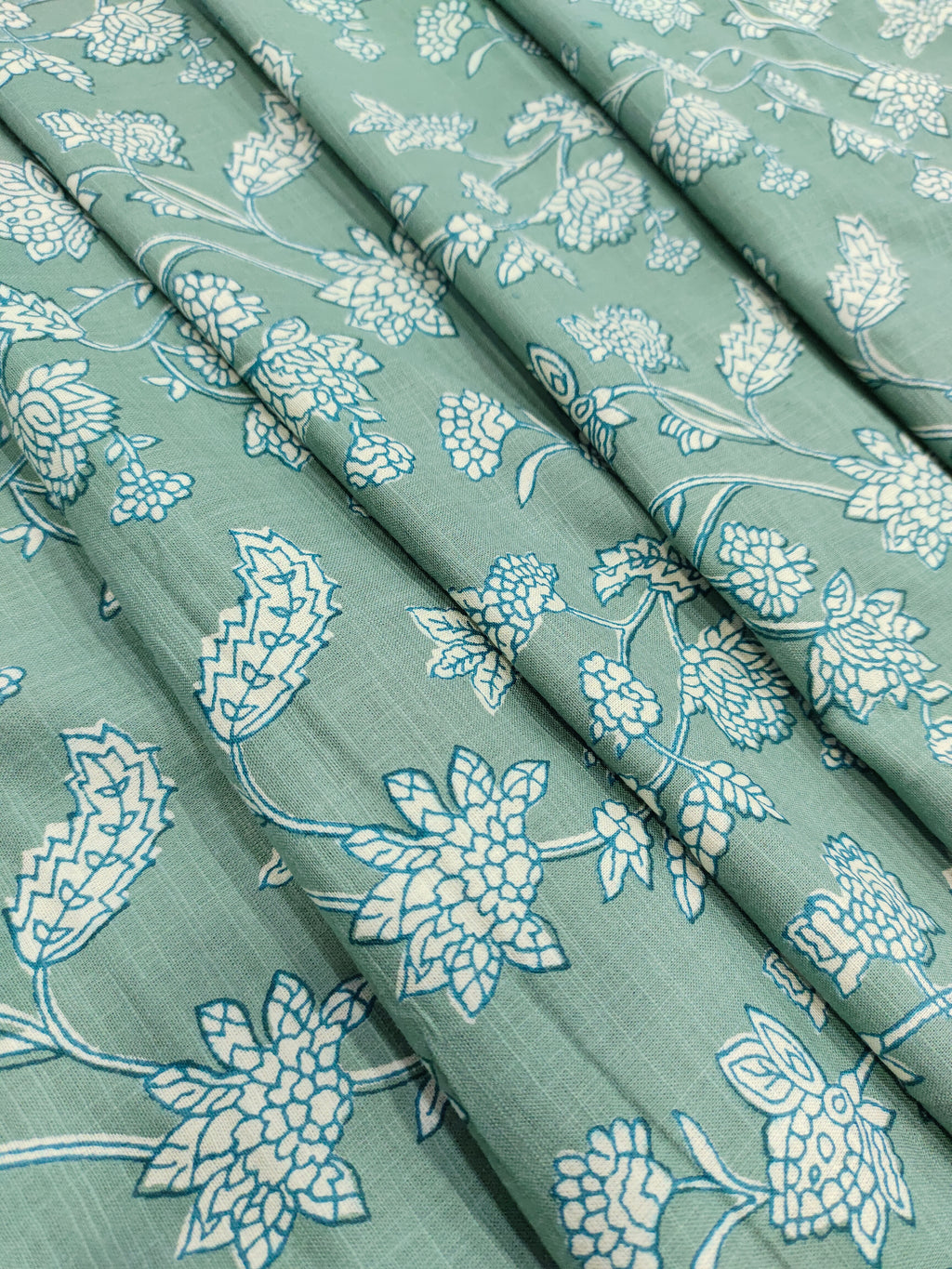 Green cotton slub printed fabric all over design.