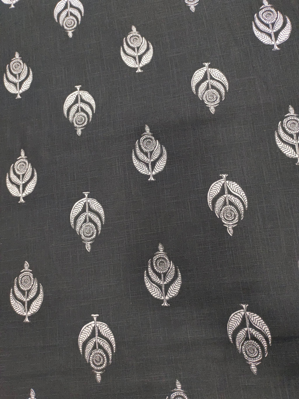Black cotton slub fabric with offwhite moghal print