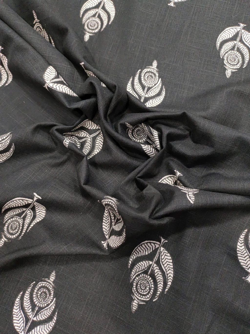 Black cotton slub fabric with offwhite moghal print