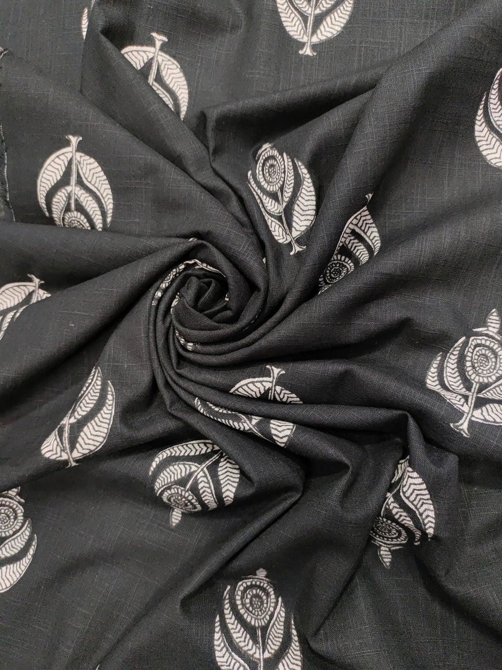 Black cotton slub fabric with offwhite moghal print