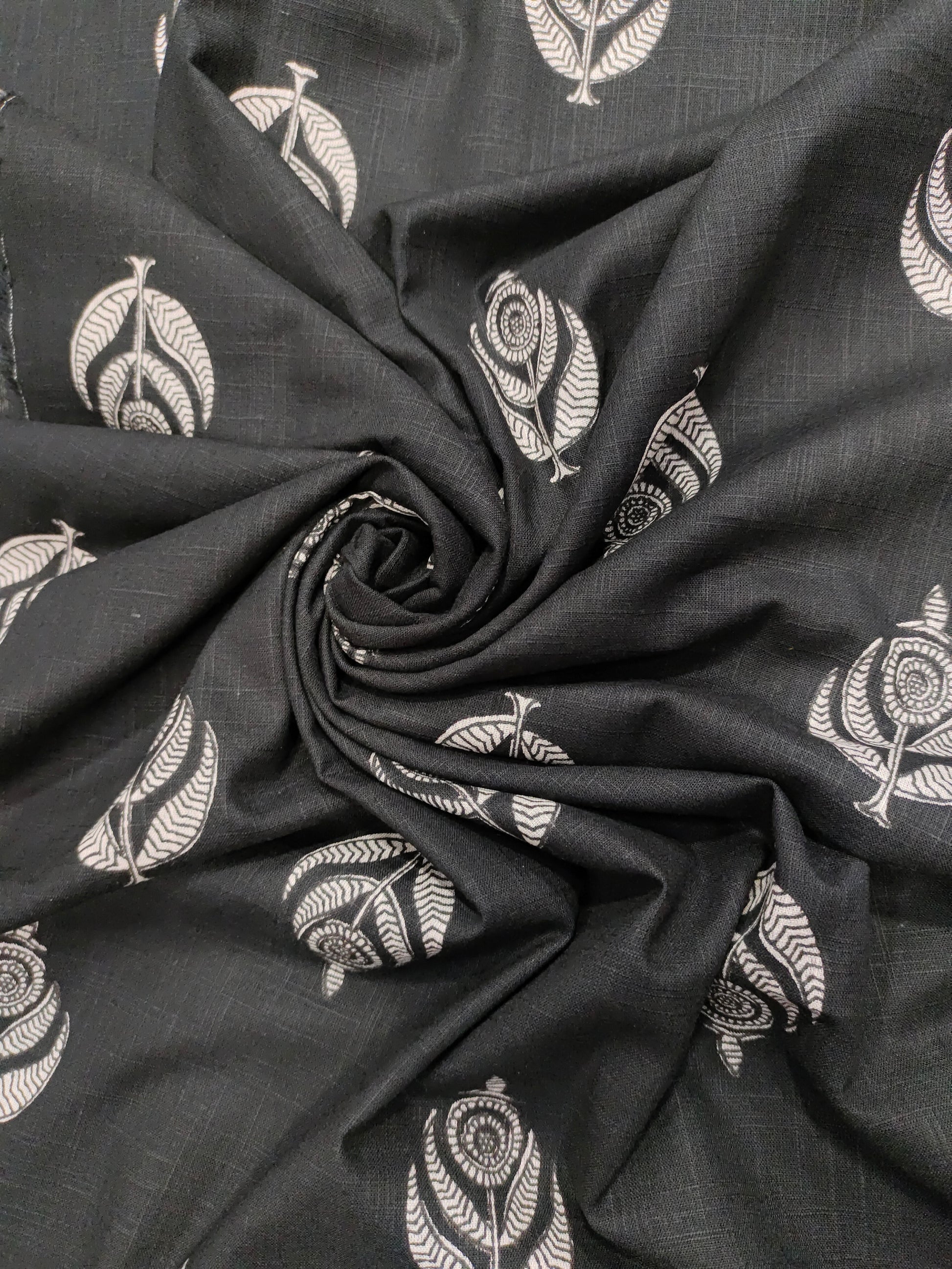Black cotton slub fabric with offwhite moghal print