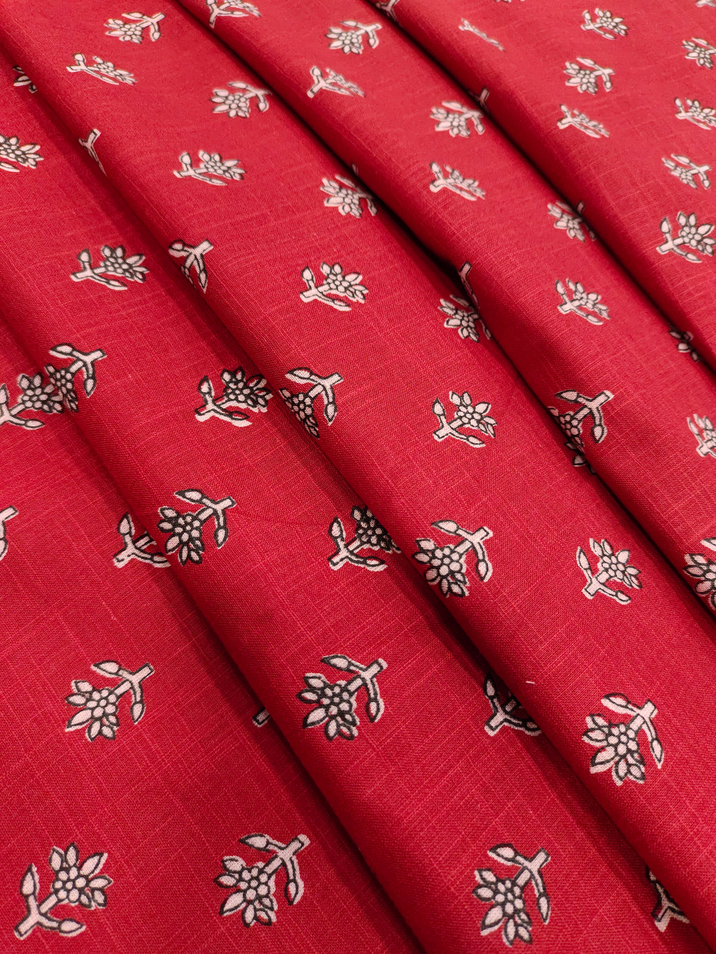 Red cotton slub small butti with black and whit.